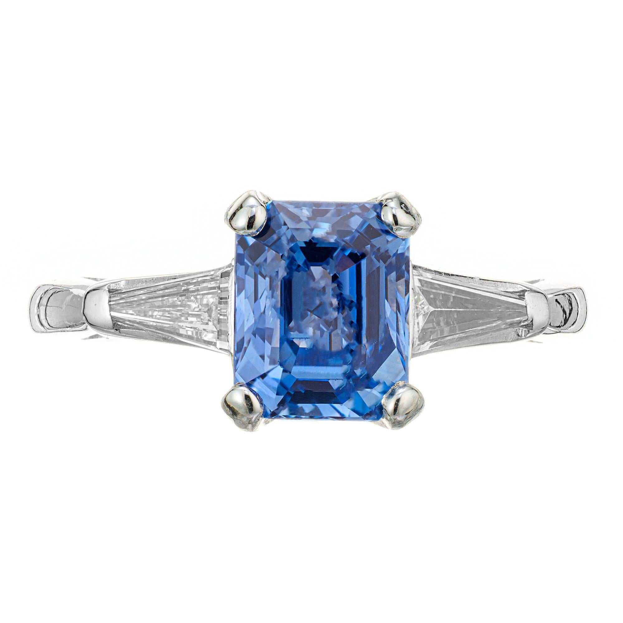 1940’s sapphire and diamond engagement ring. AGL certified center emerald cut Periwinkle sapphire in a platinum three stone setting with two tapered baguette side stones. Simple heat only. 

1 Emerald cut Periwinkle blue Sapphire, approx. total