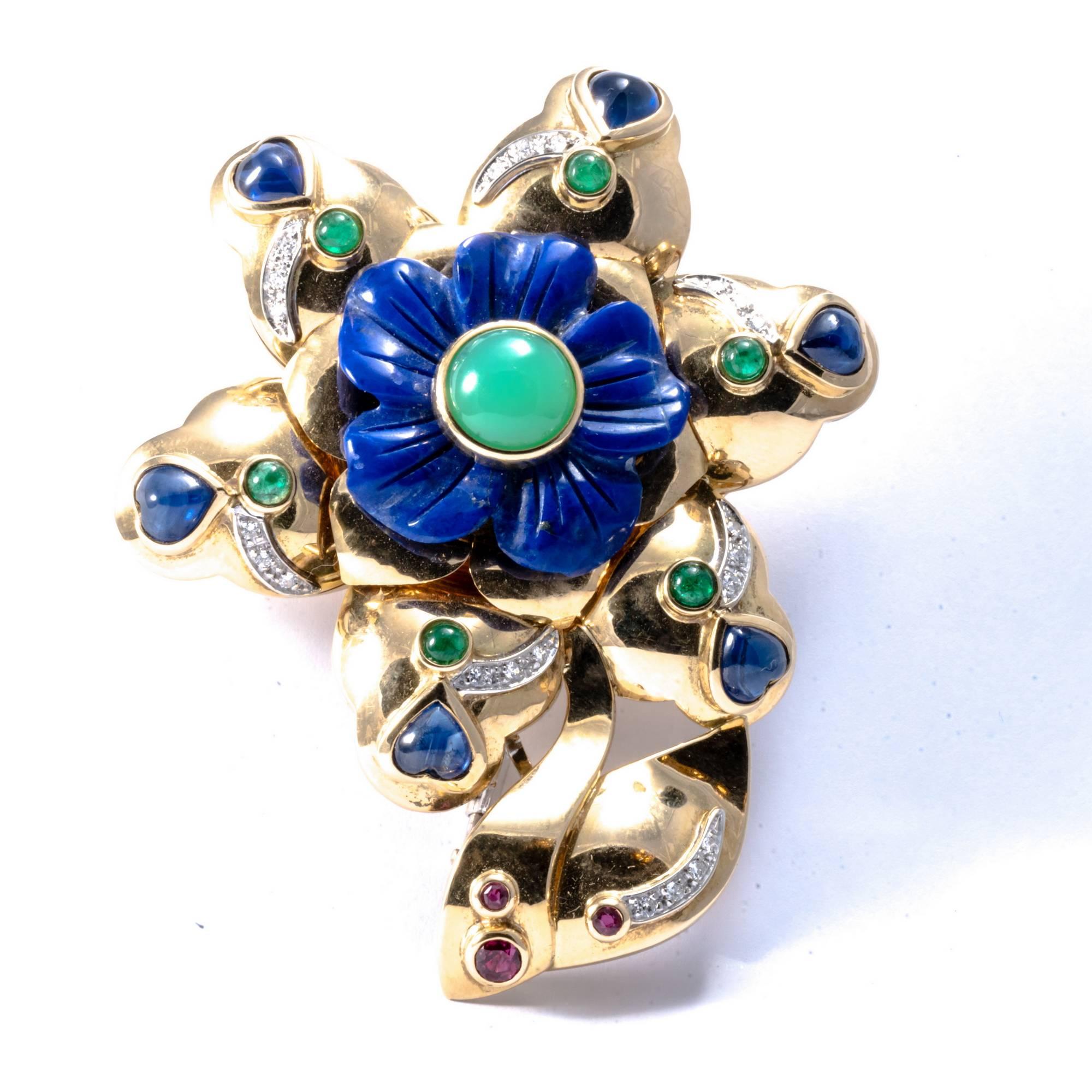 This original 1980 American pin brooch made in 18K yellow gold can be adapted to form a vivid, eye-catching necklace enhancer. It's gaudy design features strong, prominent shapes, enlightened by a variety of natural precious and semi-precious