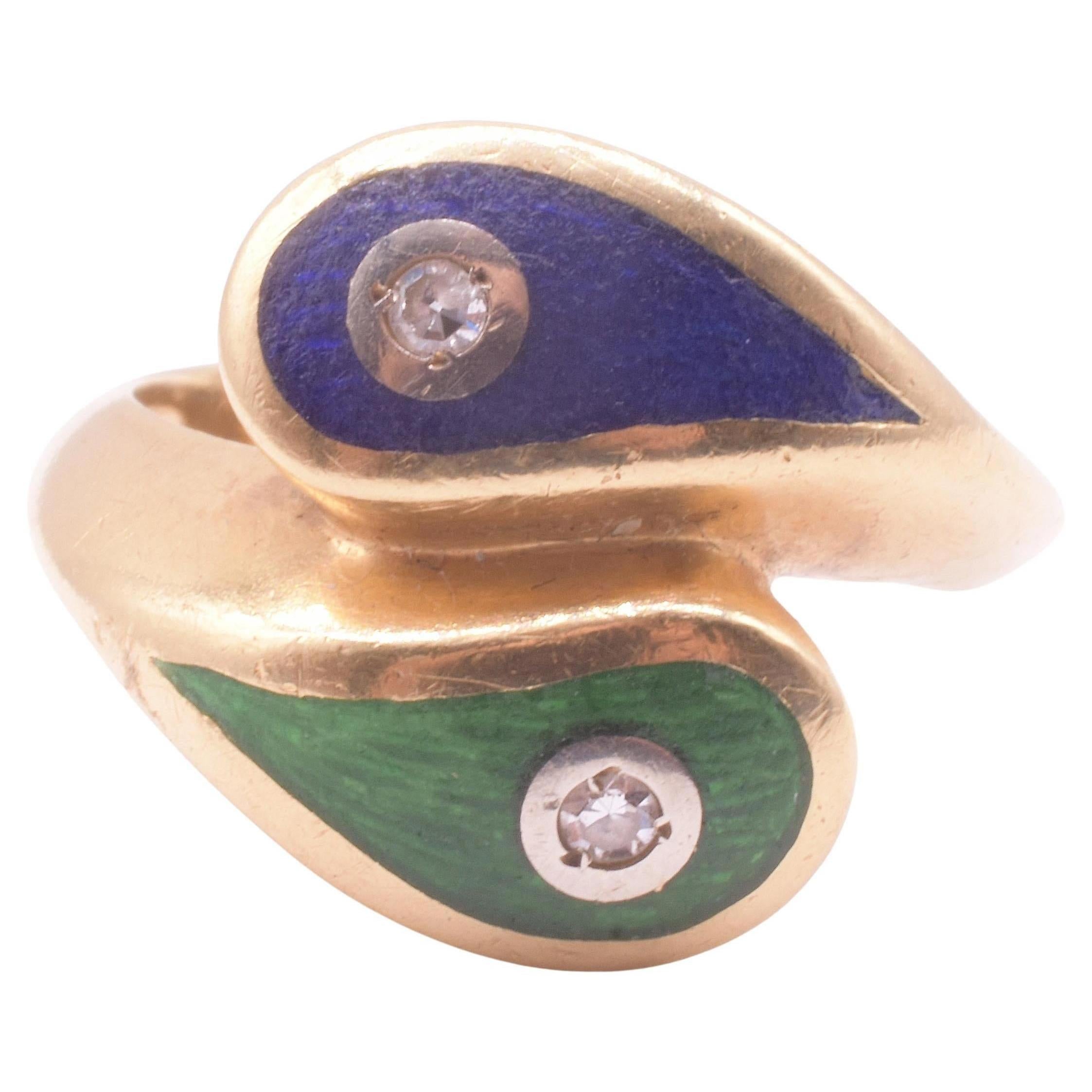 This is a fun and unique take on a modern snake ring,  modeled off the snake rings of the 19th century with the double heads and the diamond accents on each. In essence, this is an Art Deco revival of the Art Deco period of the 1920's, which was in