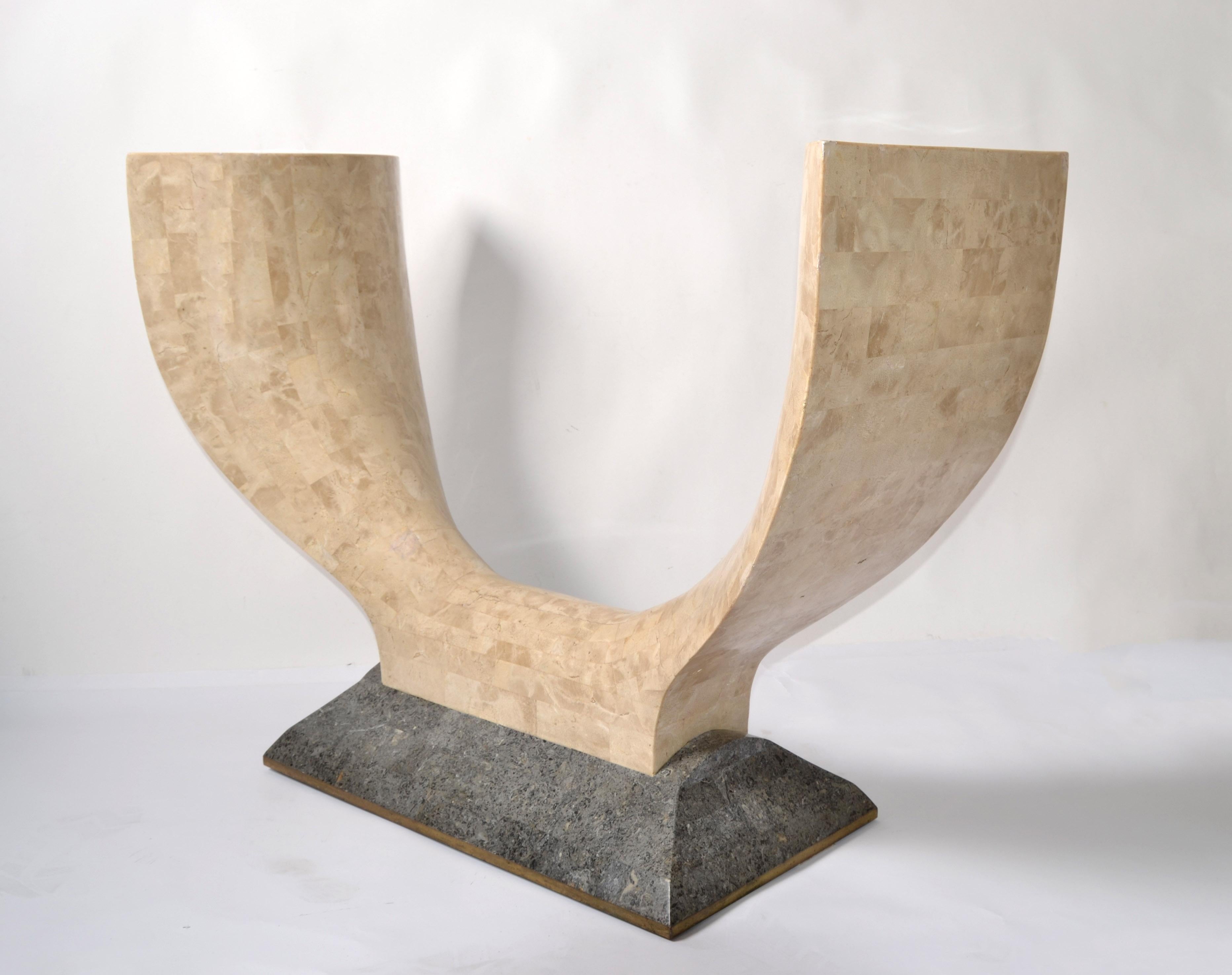 Art Deco Style Wishbone Shaped Console Table made in circa 1980 by Maitland Smith in the Philippines.
Features a beige tessellated Stone over wood semi-circle Core mounted on a slat gray marble base with Gold Leaf Border.
The Mid-Century Modern