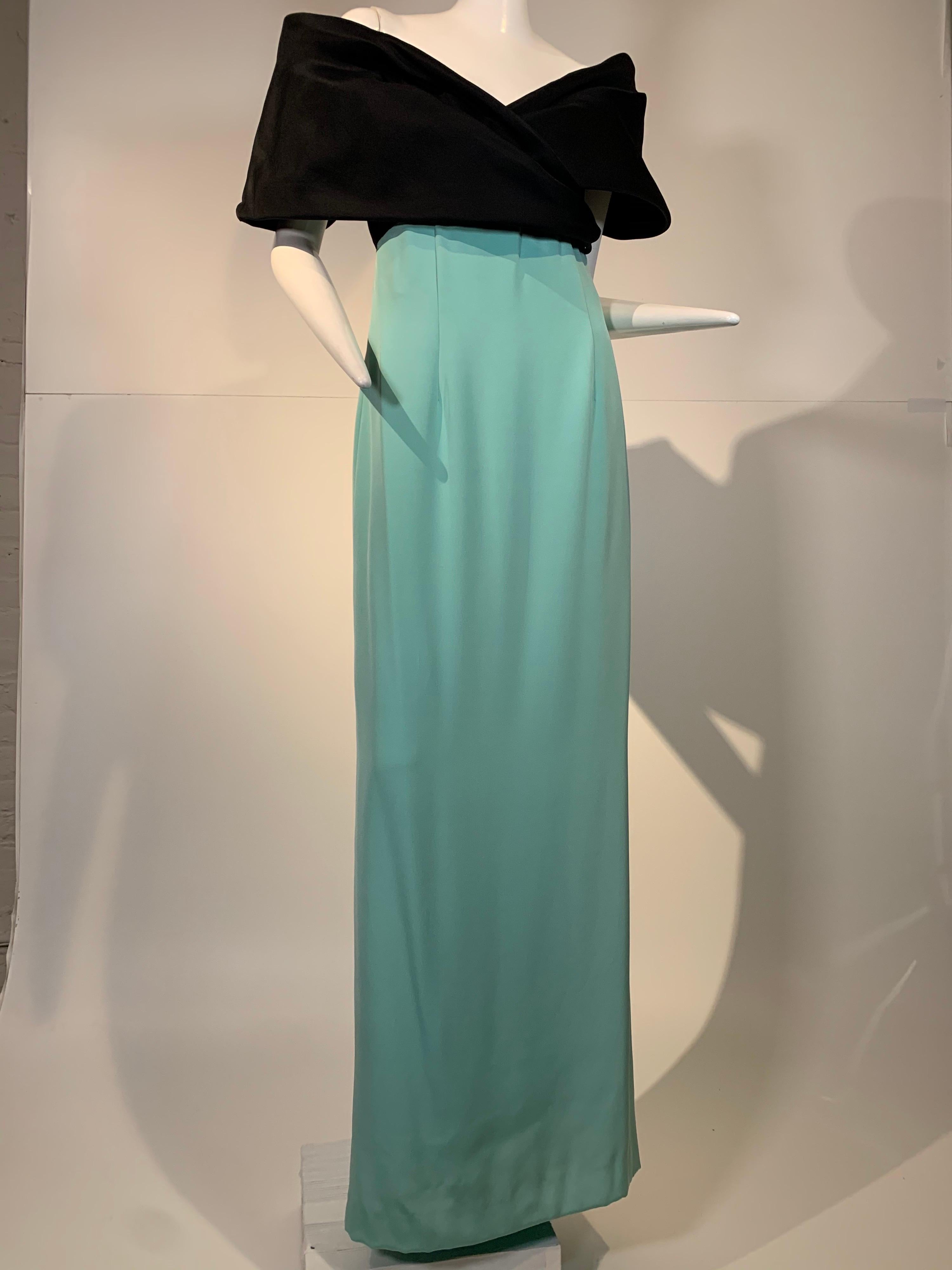 1980s Bill Blass mint crepe gown with black gazar wrap bodice and shoulders: sleeves and bodice give the illusion of a silk wrap about the shoulders and are wired for structure and volume. High Empire waist. Gown has a fishtail hemline. Size 8.