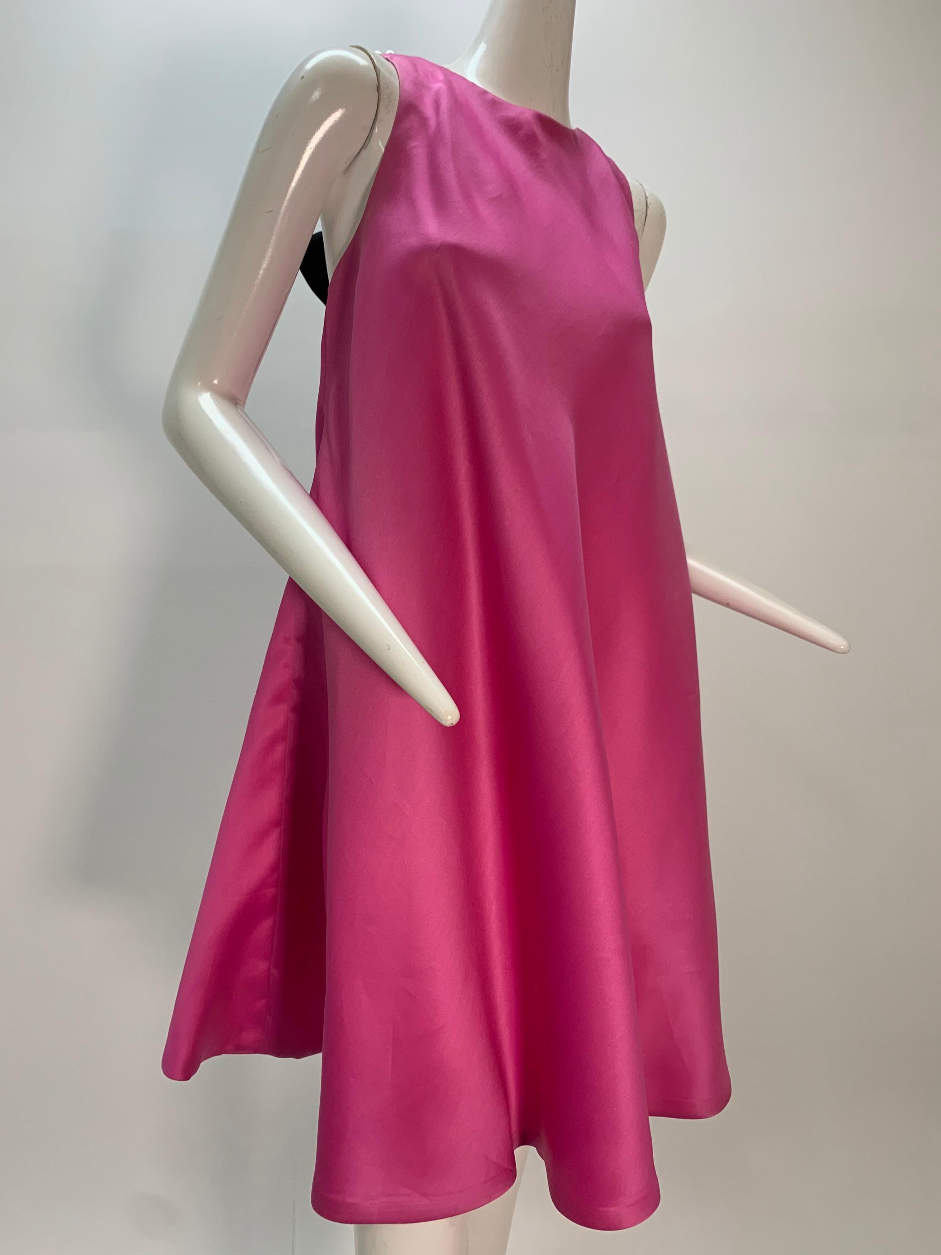 1980s Bill Blass bias-cut pink silk organza trapeze mini dress with chunky pearl strands and silk satin bow closure at back:  Fabulous! Fully lined. Zipper at back.
Fits up to a size US 6