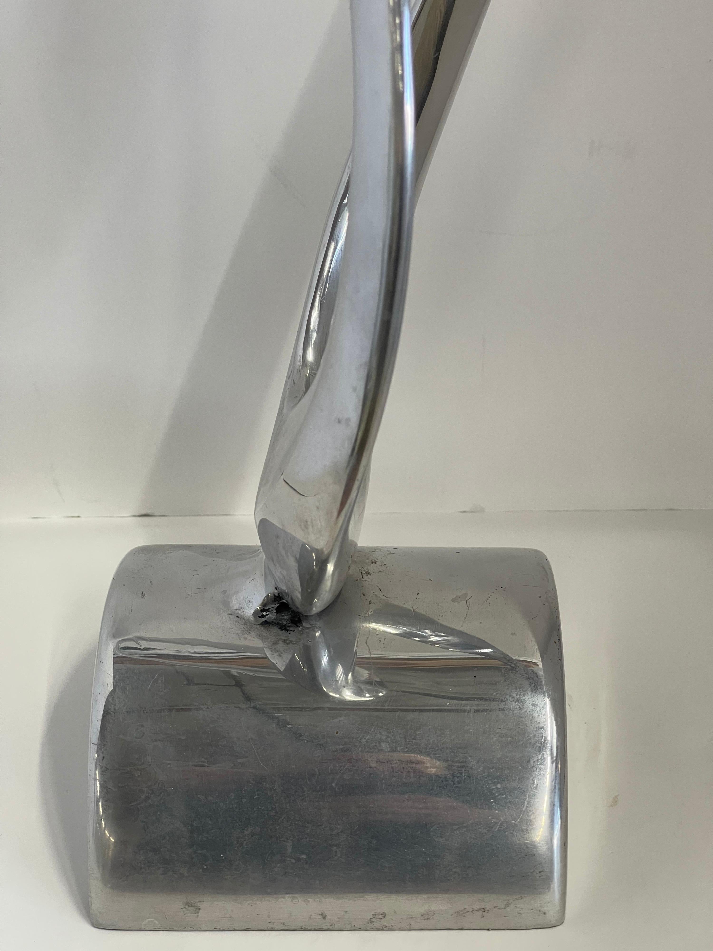 A wonderful flowing aluminum sculpture by the noted artist Bill Keating. Signed and dated 1980. In good vintage condition with some minor imperfections.