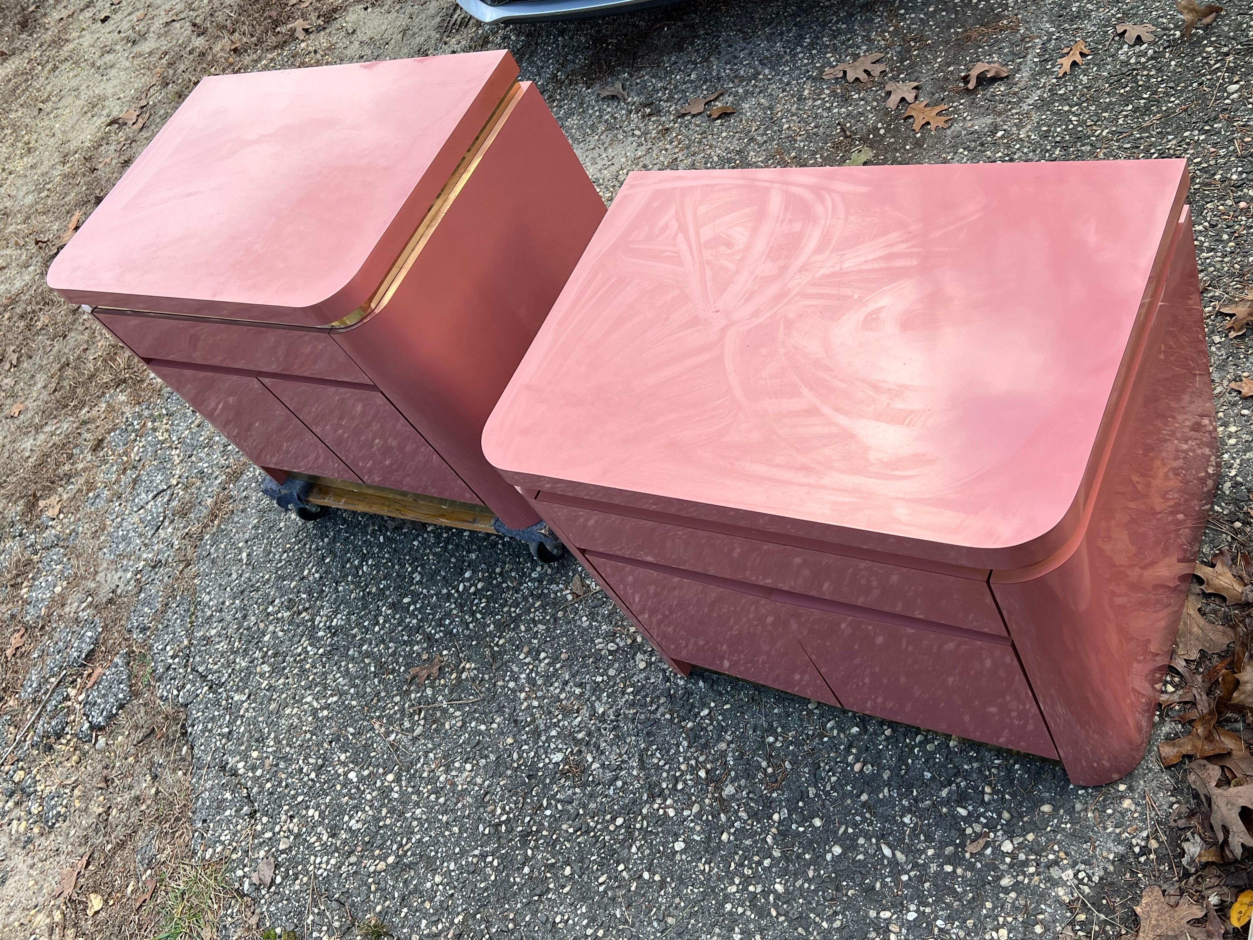 1980 Mauve Pink Laminate Nightstands - a Pair

Custom made in 1980 with the beautiful brass trims. We have the matching King headboard and platform posted in a separate listing.