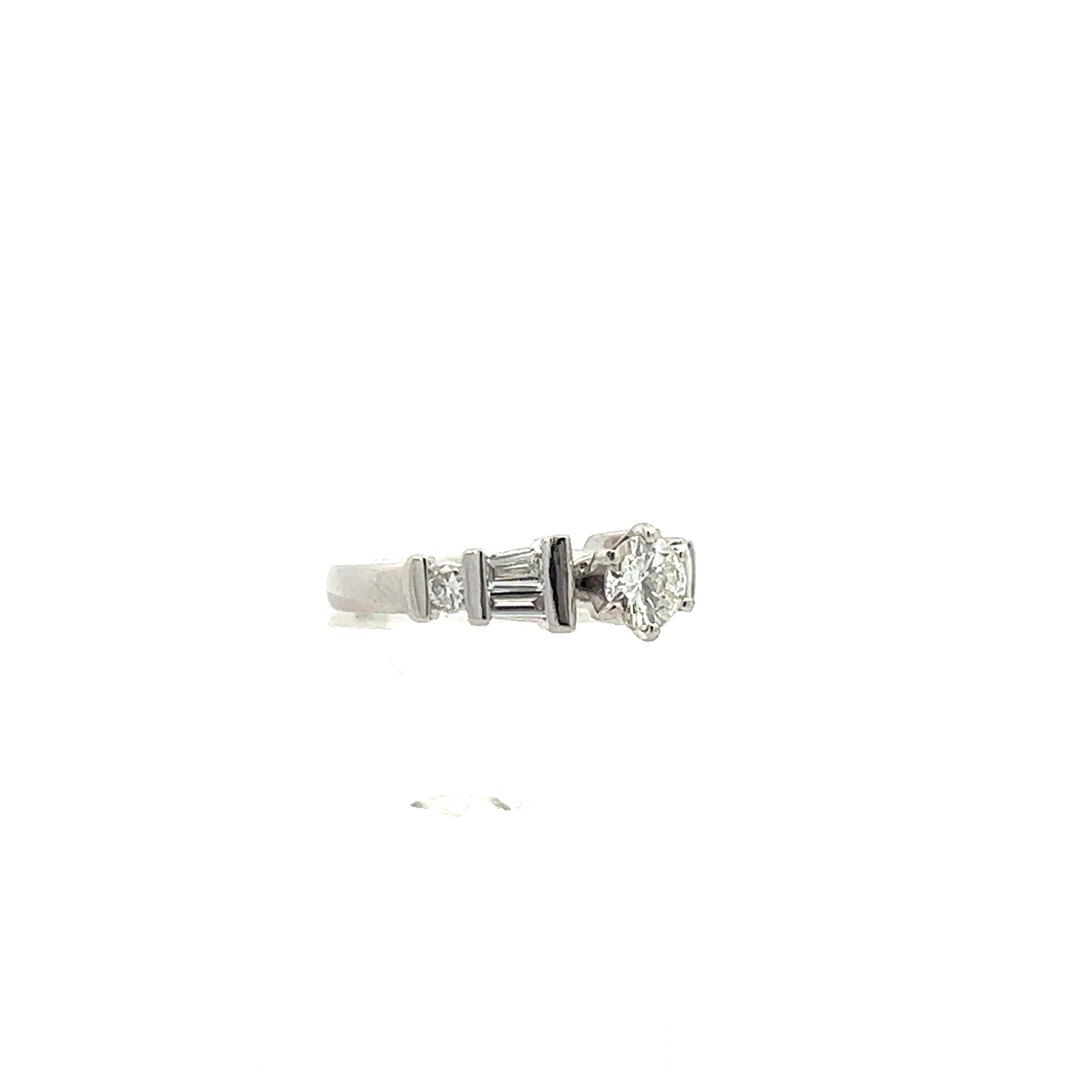 1980 Contemporary Platinum Round/Baguette Diamond Ring For Sale 3