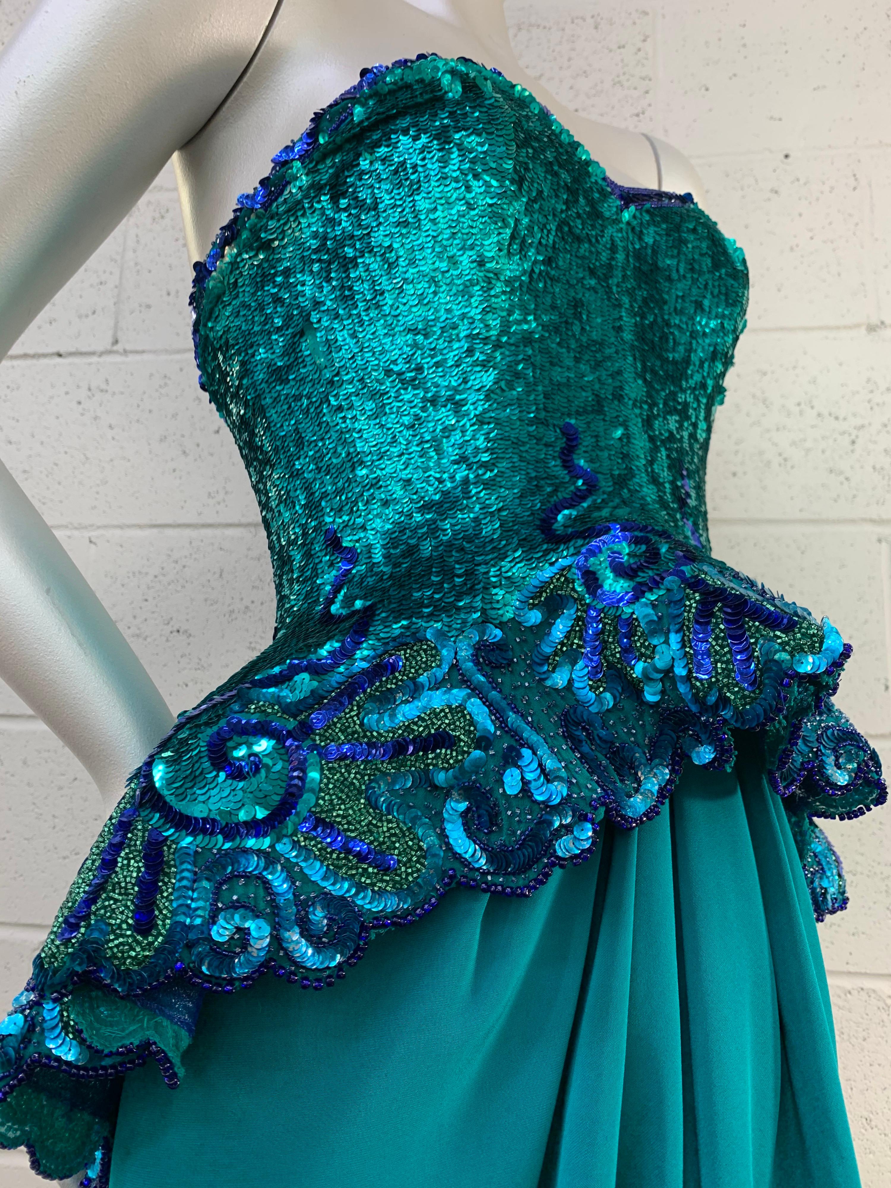 A spectacular 1980s Fabrice Simon lagoon blue sequin and satin strapless gown with voluminous peplum: A vibrant and stunning color palette of sequins and Arabesques flow down this strapless and boned bodice to a pool of draped teal silk satin in