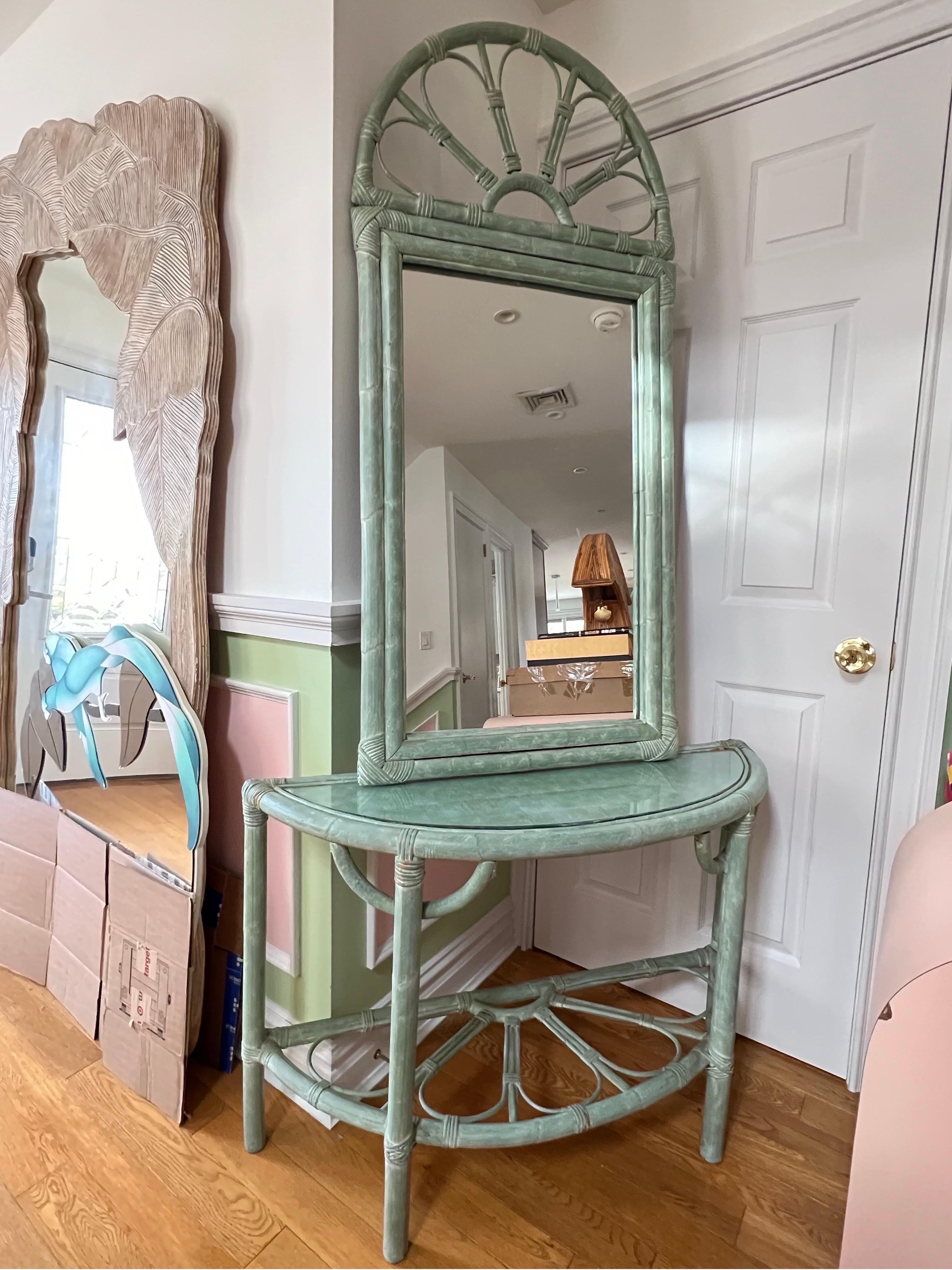 Teal color rattan set of console table and mirror, made in 1980. Perfect for the hallway or entrance.

Mirror dimensions 
Height: 54.5
Width: 26
Depth: 2

Console table dimensions 
Height: 28
Width: 42
Depth: 14.5