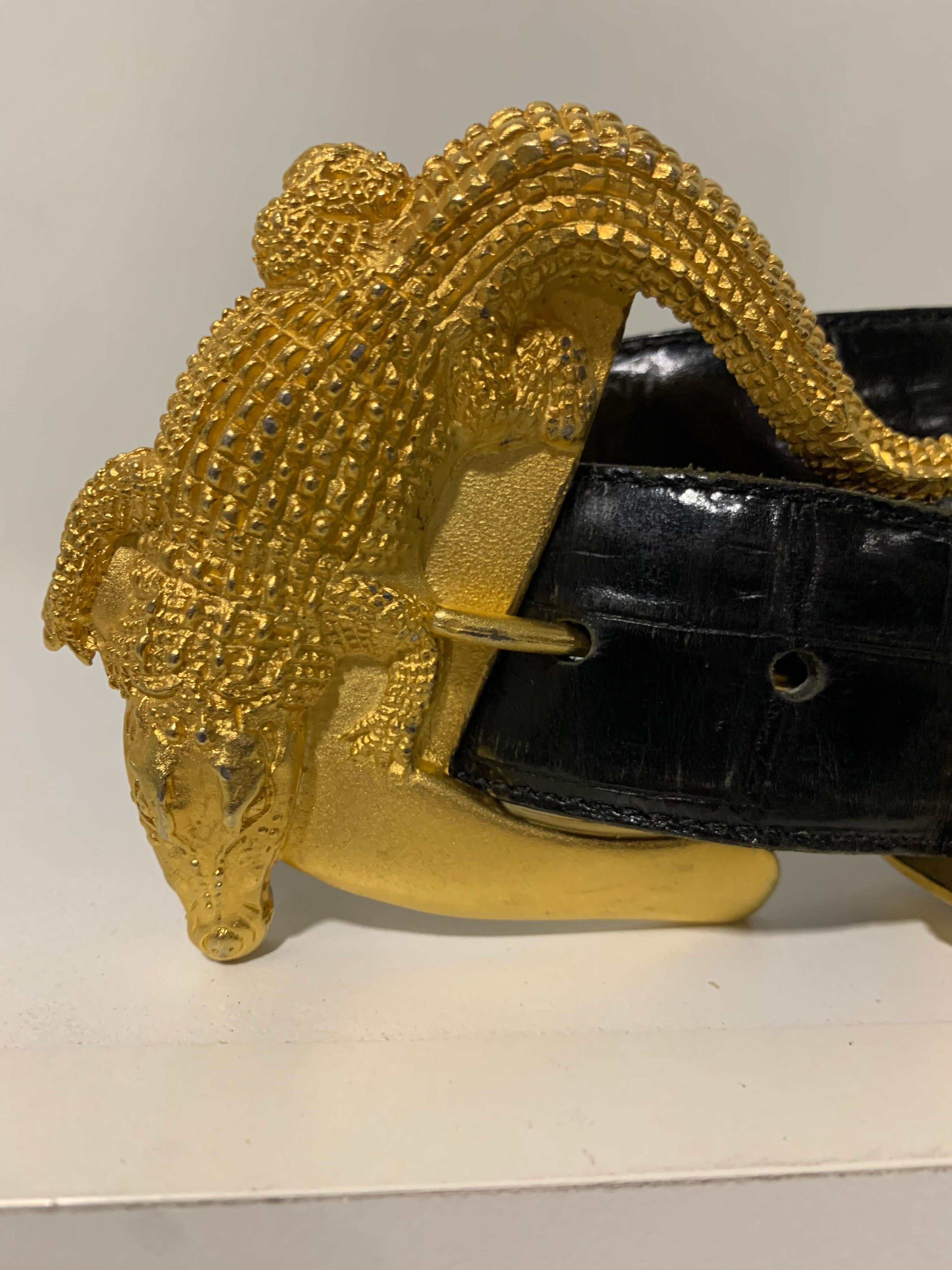 1980s Hartnell black crocodile-embossed leather belt with gold-tone 3-dimensional alligator sculptural buckle and tip cover. Marked size XL. 