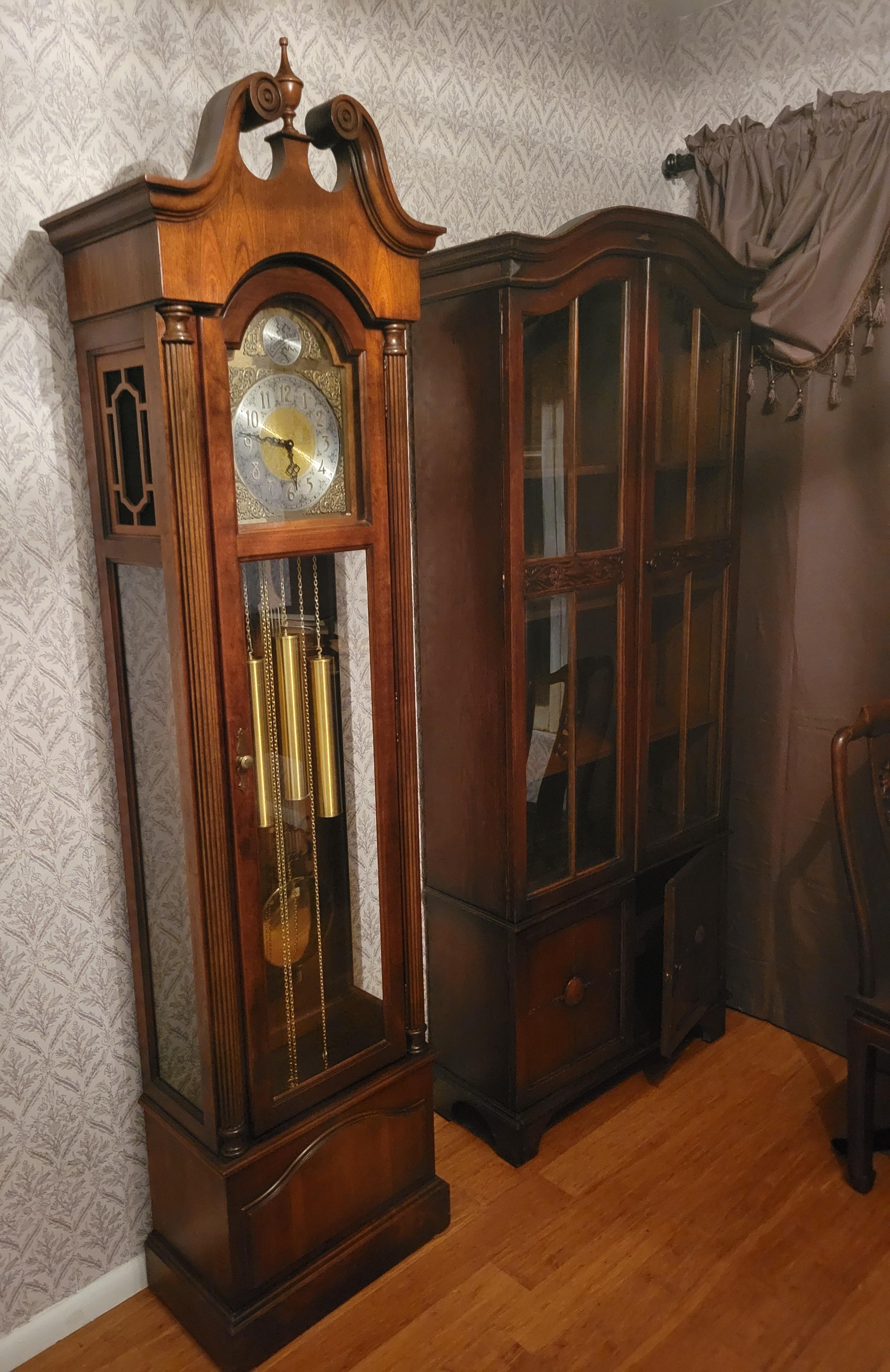 1980, Howard Miller Grandfather Clock.. Model #610-232 with Hermle 451-050H movement; serial number 278497. The clock has walnut case with sound panels and measures 80