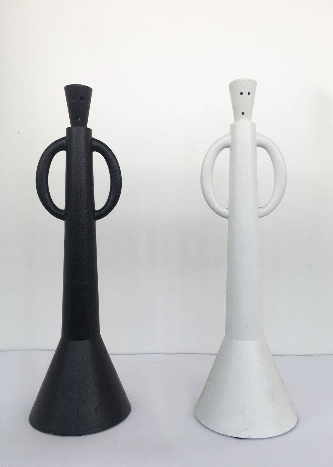 This artwork was created by the Italian artist Alessandro Guierriero, it is a multiple of a serie of specimens made in limited edition not numbered.
The set is forged in aluminum and painted in black and white. Their arms are handles to manage them