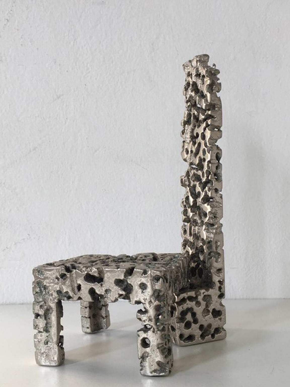 Urano Palma is an Italian artist who starts to create his artworks following the philosophy of Lucio Fontana.
He specially worked to the sculptured furniture, inventing a casting technique to obtain the perforated solid metal.
The chair is separated