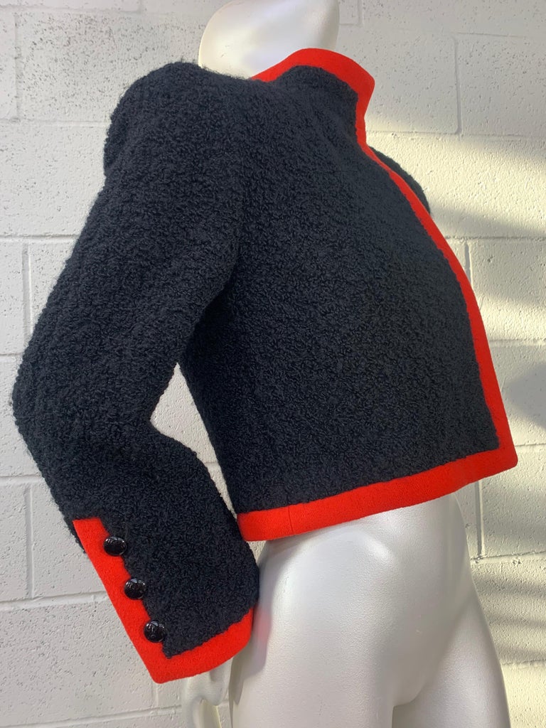 1980 James Galanos Black Boucle Wool Jacket w/ Orange Knit Piping: Flared button sleeves and a cropped waist conjure a futuristic military vibe. Size 8. 