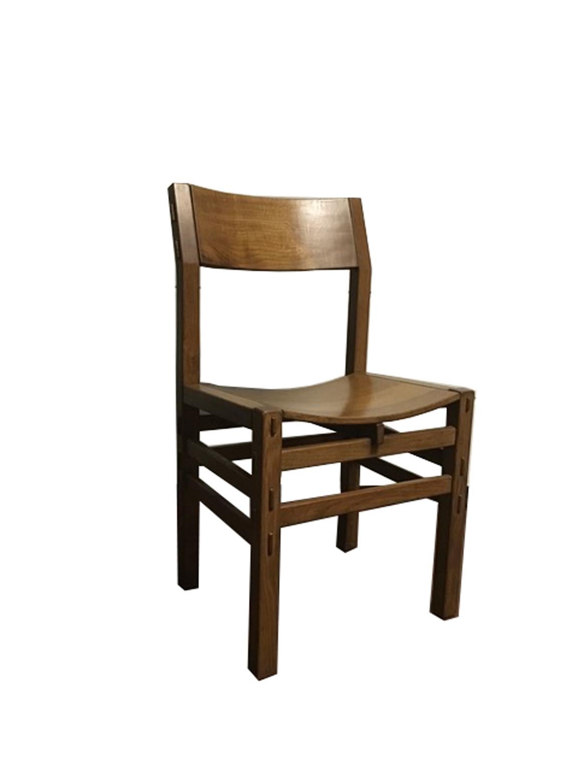 This set of eight dining chairs were made by Officina Rivadossi at the beginning of their history as Officina Rivadossi, a well-known woodworking shop for its high-level furniture, as works of art. Every piece carefully made one by one in solid oak.