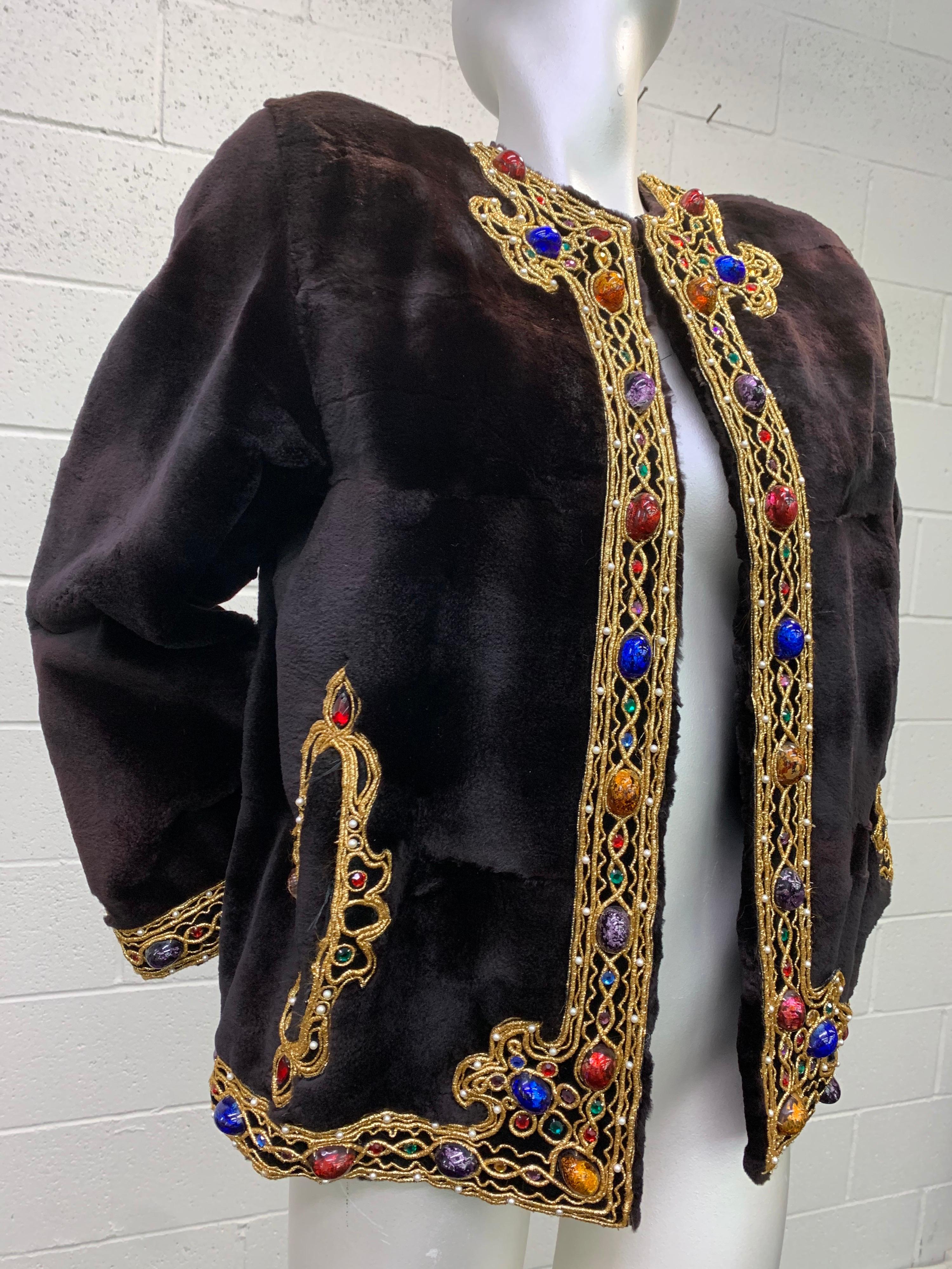 1980s Oscar de la Renta sheared mink fur jacket with bejeweled gold braid trim:  Boxy cut jacket features cabochon glass faux jewels set with faux pearls and gold braid lining the hem, front placket and slash pockets. Lush sheared ebony mink is so