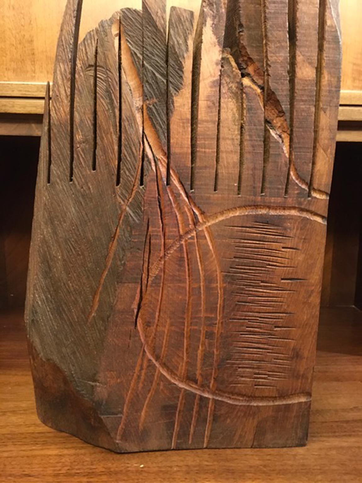 Franca Vitti was an Italian, Northern Italy based, artist well known also for her iron artworks.
She spent a part of her life in Africa and for this reason this piece sculpted in raw pine wood, shows a great primordial force. 
For its natural spirit