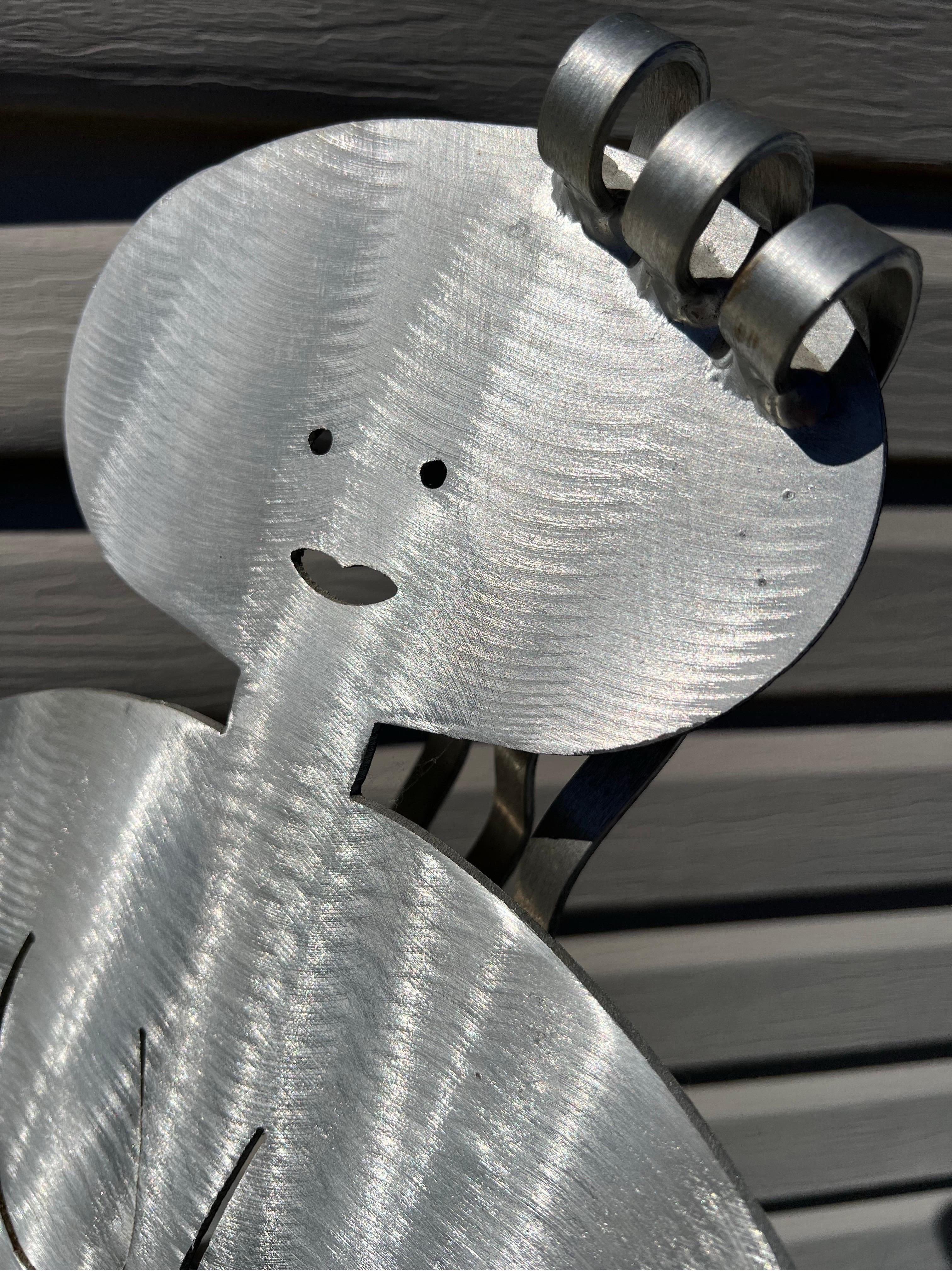 1980 Postmodern Fred Gartboz Aluminum Woman Body Magazine Rack. An unique piece to place in your office room or living room. It will sure catch your guest's attention.