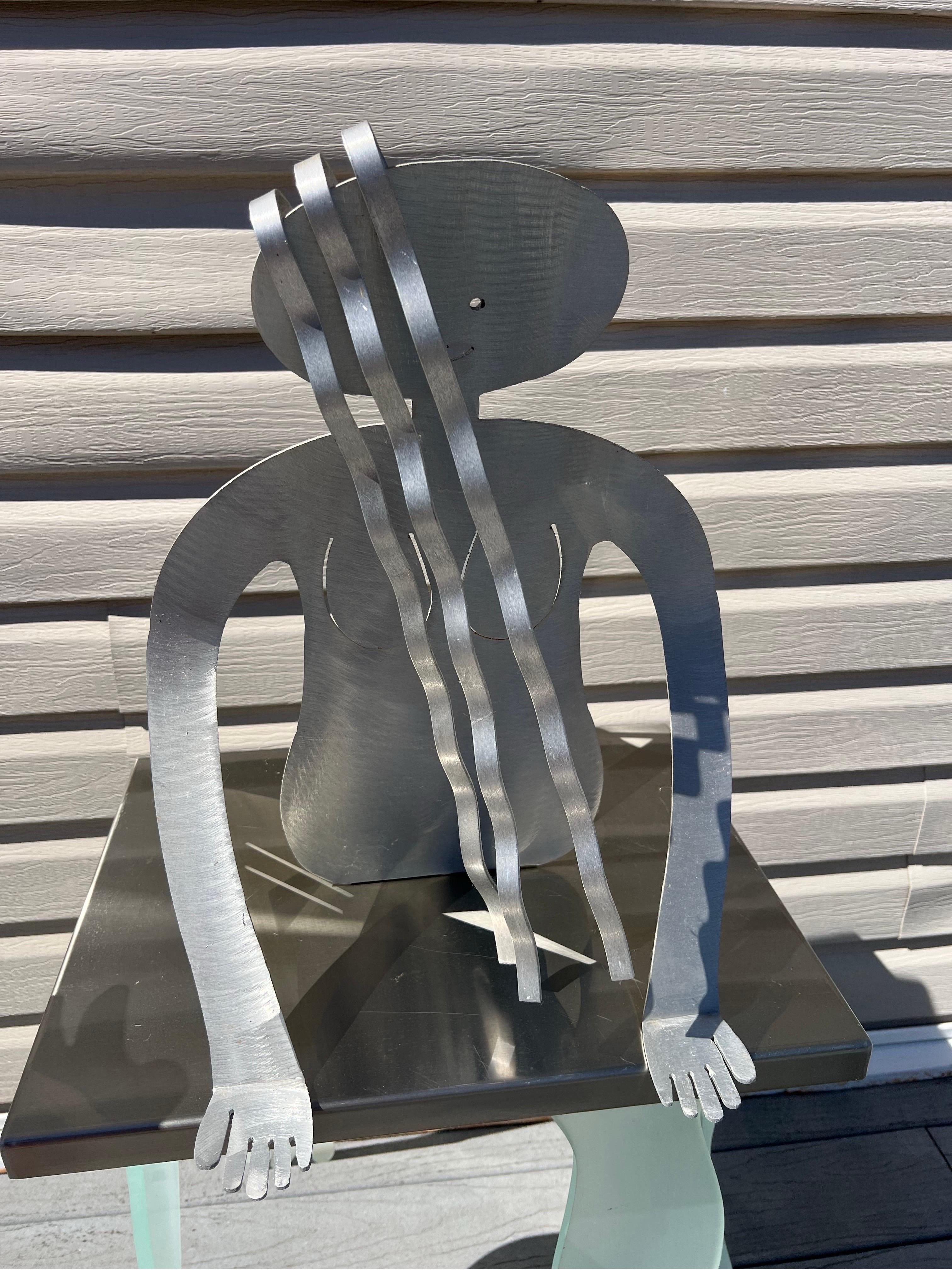 American 1980 Postmodern Fred Gartboz Aluminum Woman Body Magazine Rack For Sale