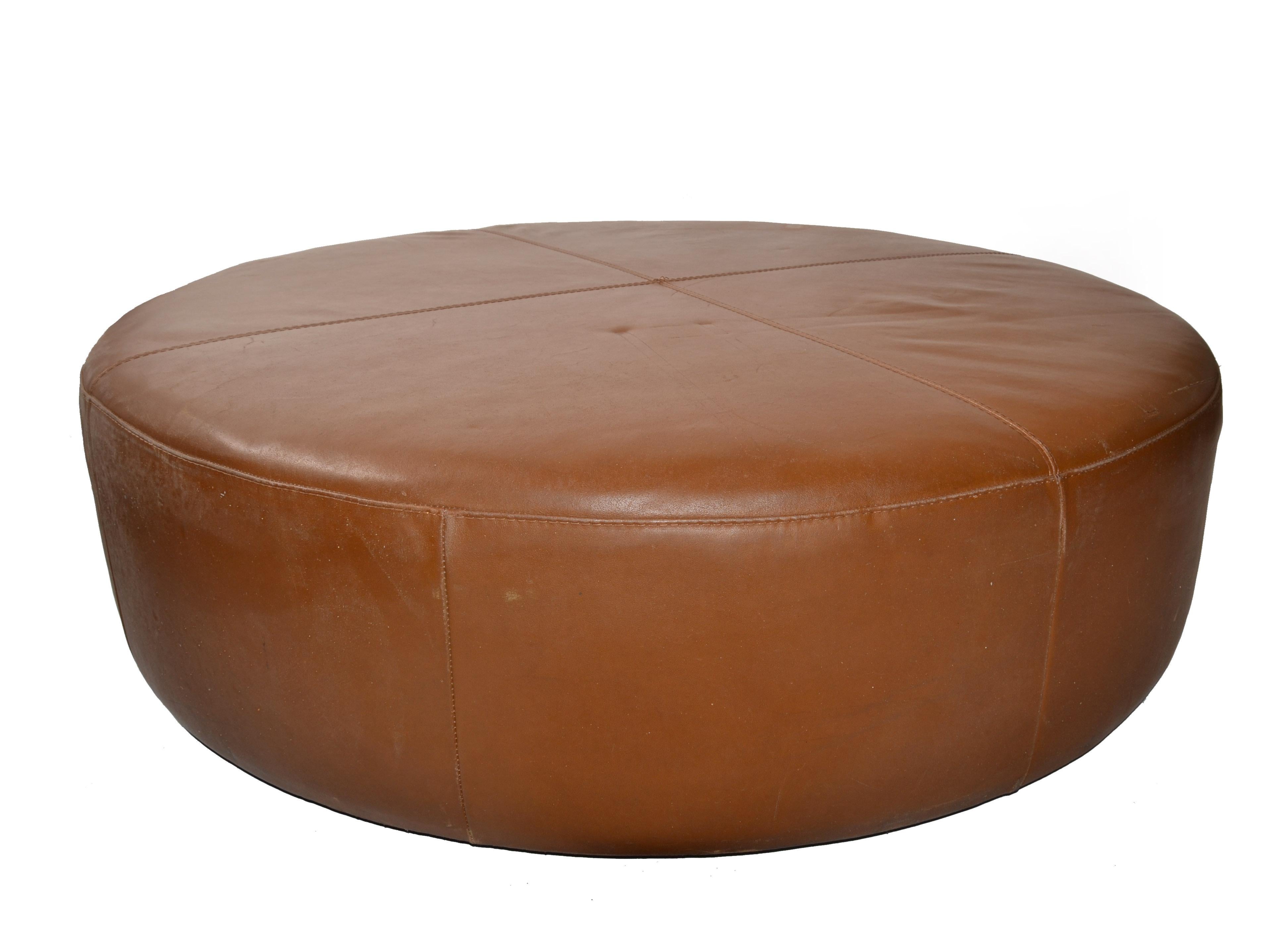 This Mid-Century Modern oversized round footstool from the late 1980s is a comfortable Center Seating with a sewn cross pattern made of brown patent leather, attributed to the Harry Large Ottoman which was created by Italian designer Antonio