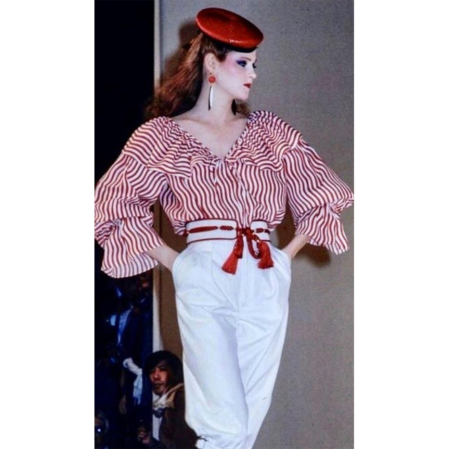 This is a dramatic vintage blouse from the Yves Saint Laurent Spring/Summer 1980 collection! Yves Saint Laurent designed beautiful blouses and this one can be worn with many things you already own! This top was featured on the runway and we love