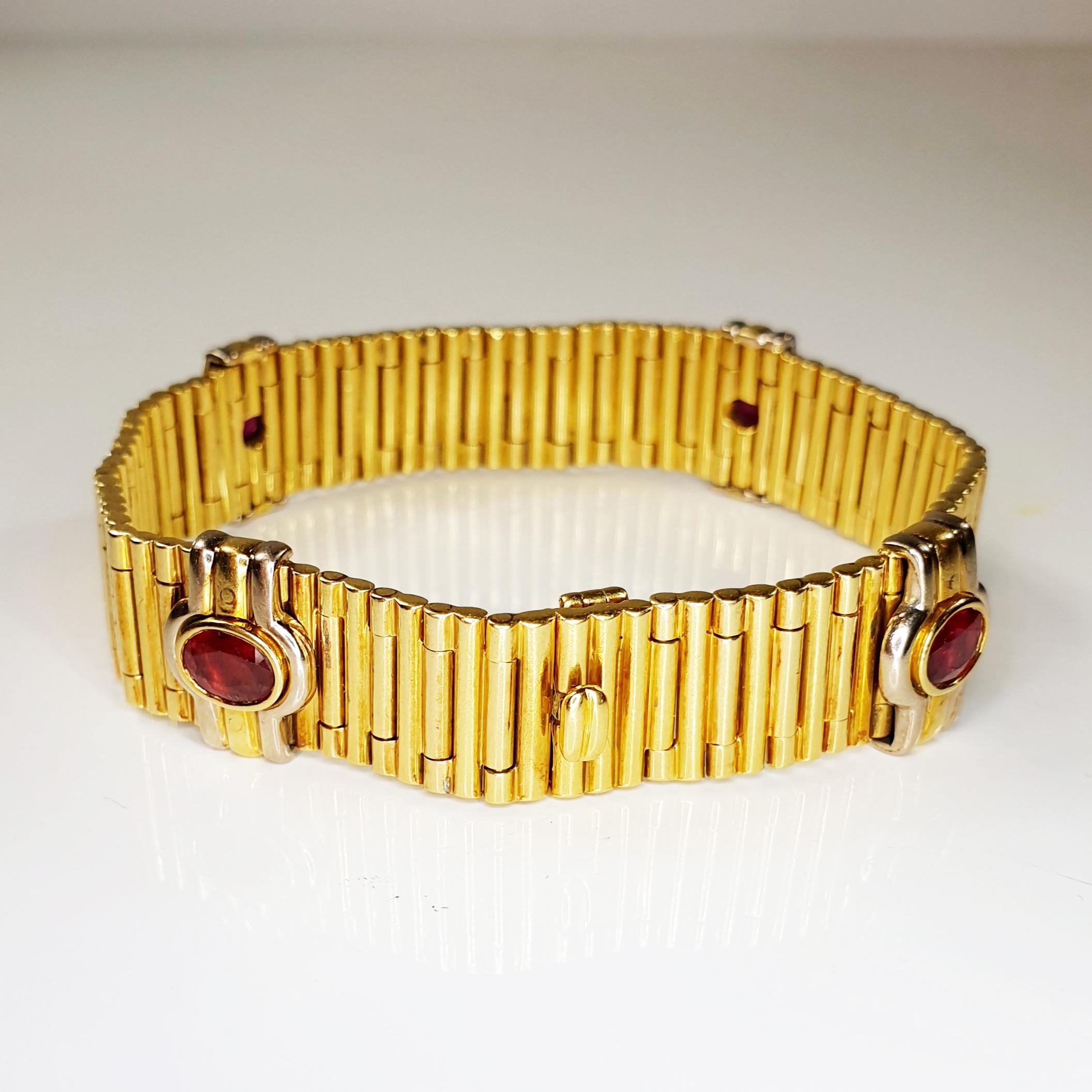 1980´s rouleaux compose bracelet manchette with 18k yellow and four 4ct oval rubies framed in yellow and white gold. A collectors piece. 
The Rouleaux (a.k.a. Bullet) bracelet has its name derived from the French word for «rolls». It consists of a