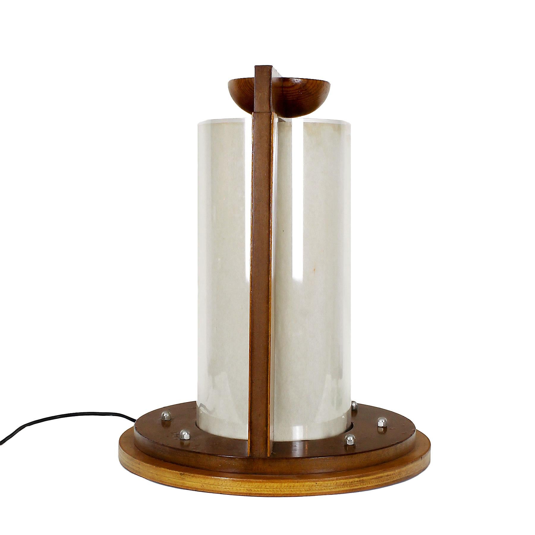Table lamp, MDF with applications of beech and pine wood, central plexiglass cylinder with parchment paper inside. Three unique items made for a Night club in Figueras.
Spain, Figueras, c. 1980

