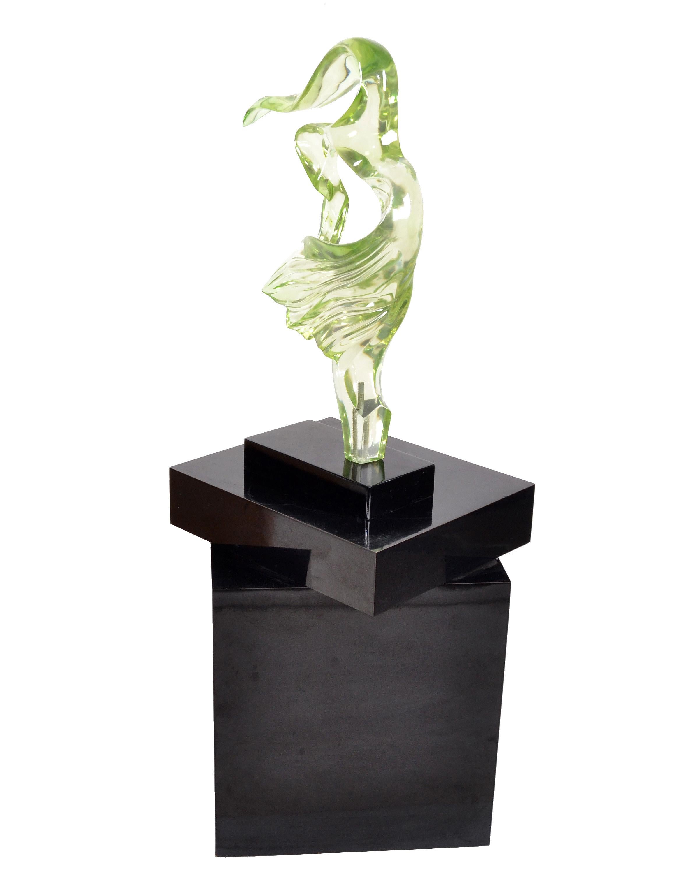 Abstract 28 inches tall neon green Lucite sculpture mounted on a black lacquered wooden base from the 1980s.
Mid-Century Modern era.
   