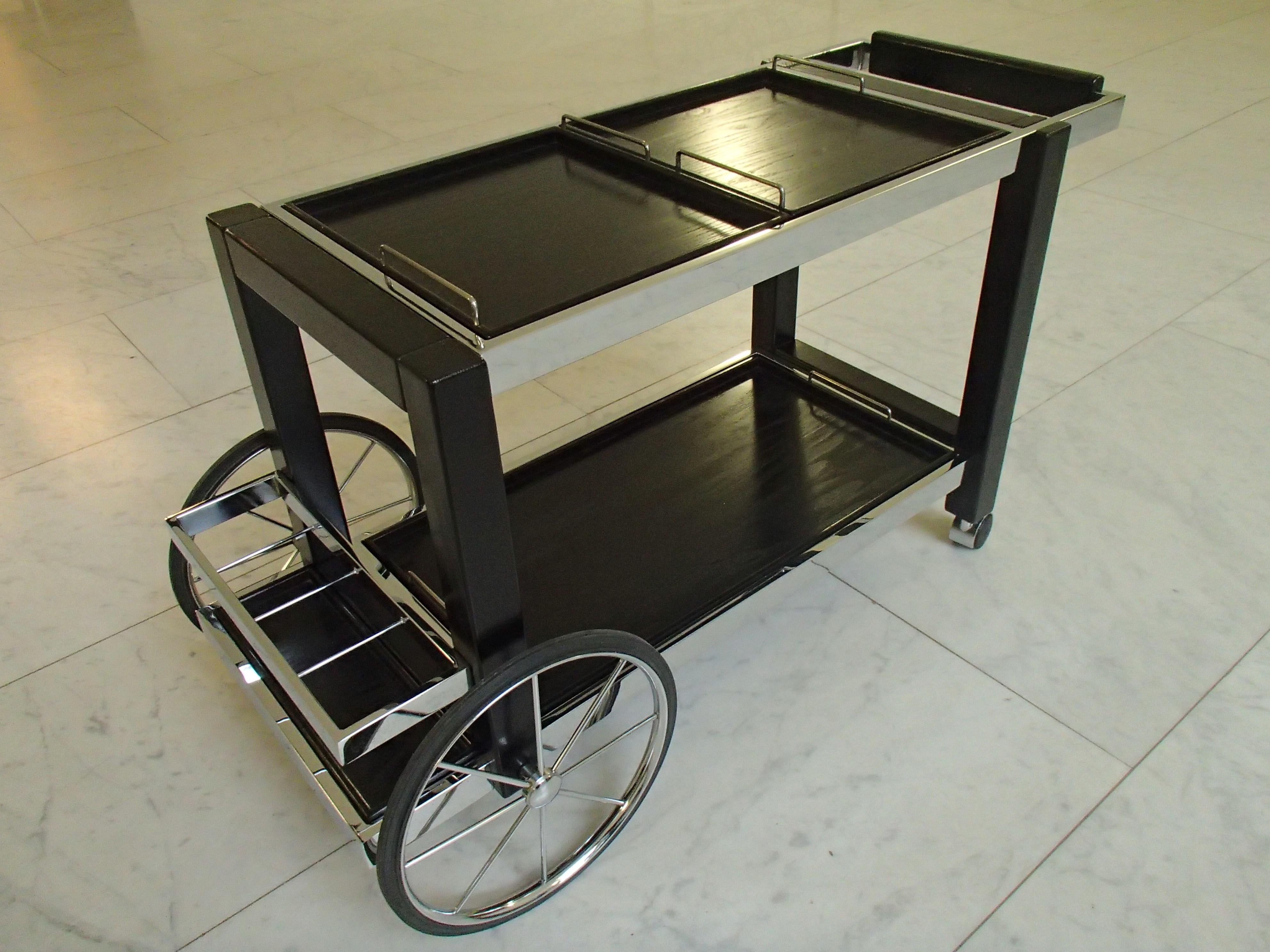 1980, this modern chrome and black oak large trolley bar cart with 2 small and 1 big trail they can be placed on the upper or lower side.
   