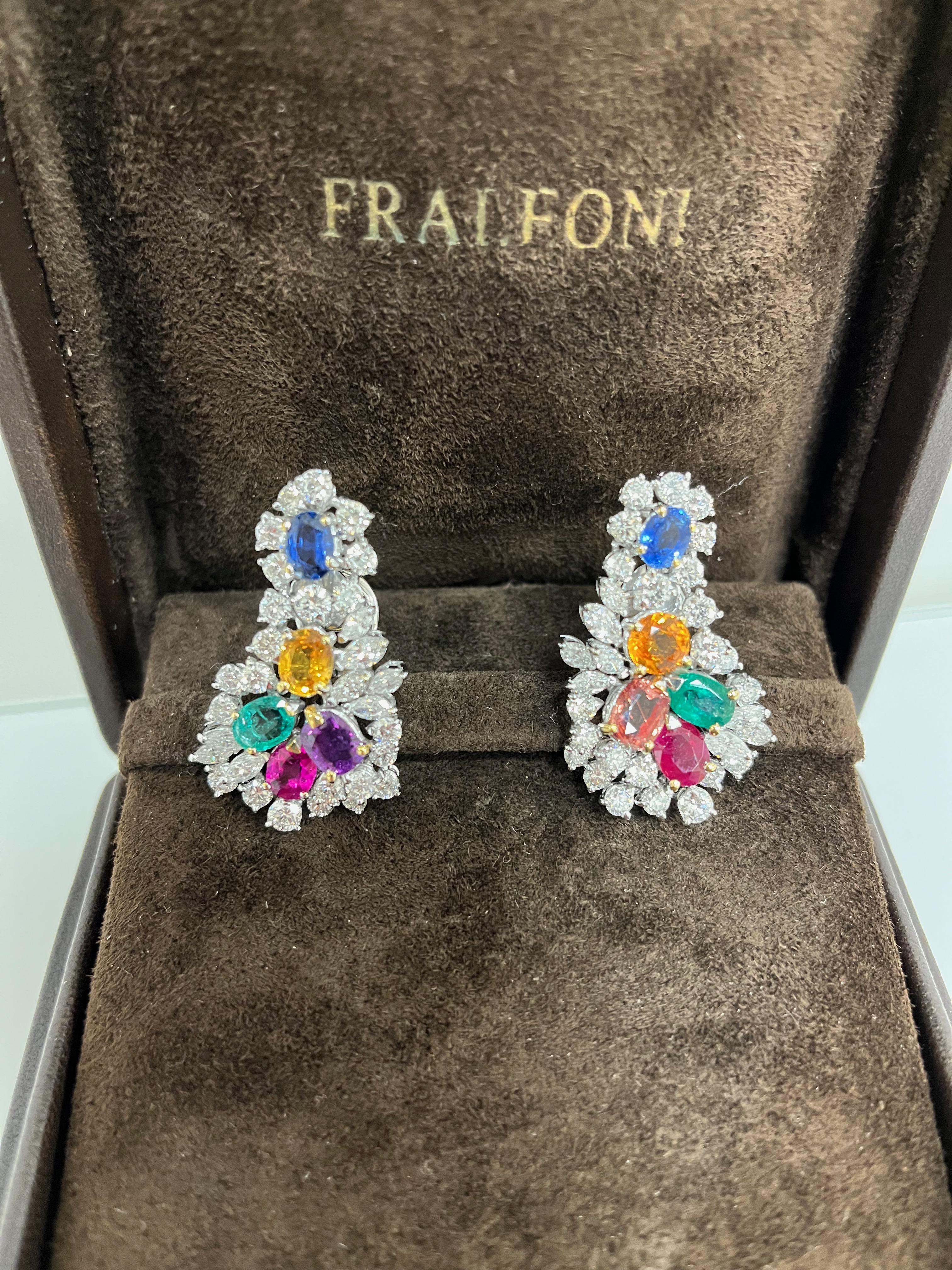 Pair of 1980 Tutti Frutti clip earrings realized in 18 kt. white gold with 5.19 carats of round cut diamonds, 1.83 carats of navette diamonds and 9.73 carats of emeralds, rubies and sapphires.
Each earring has pin and clip.
One of a kind