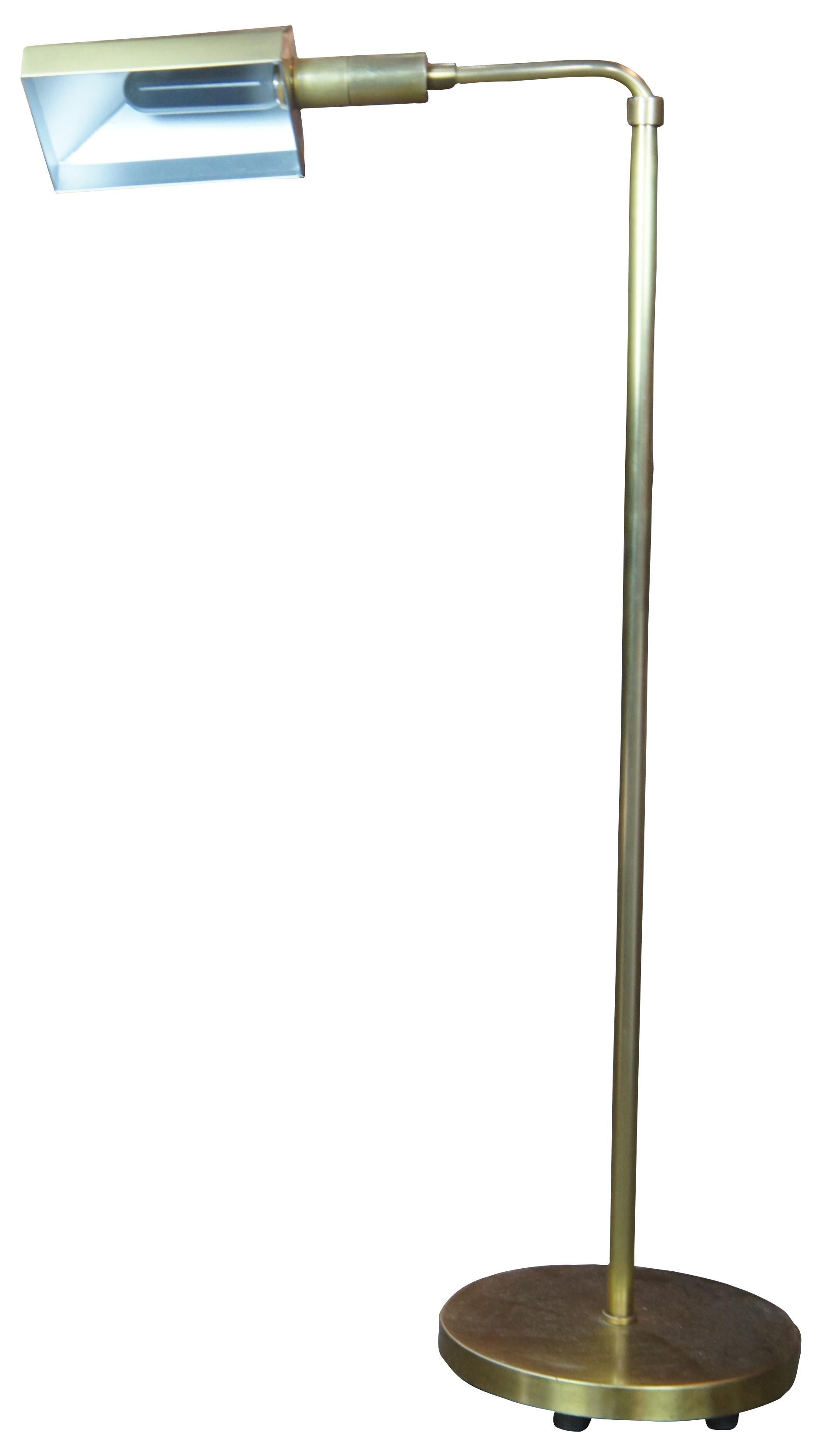 1980 Chapman Mfg Co adjustable floor lamp. Made of brass featuring round base with triangular geometric form shade. Measures: 38