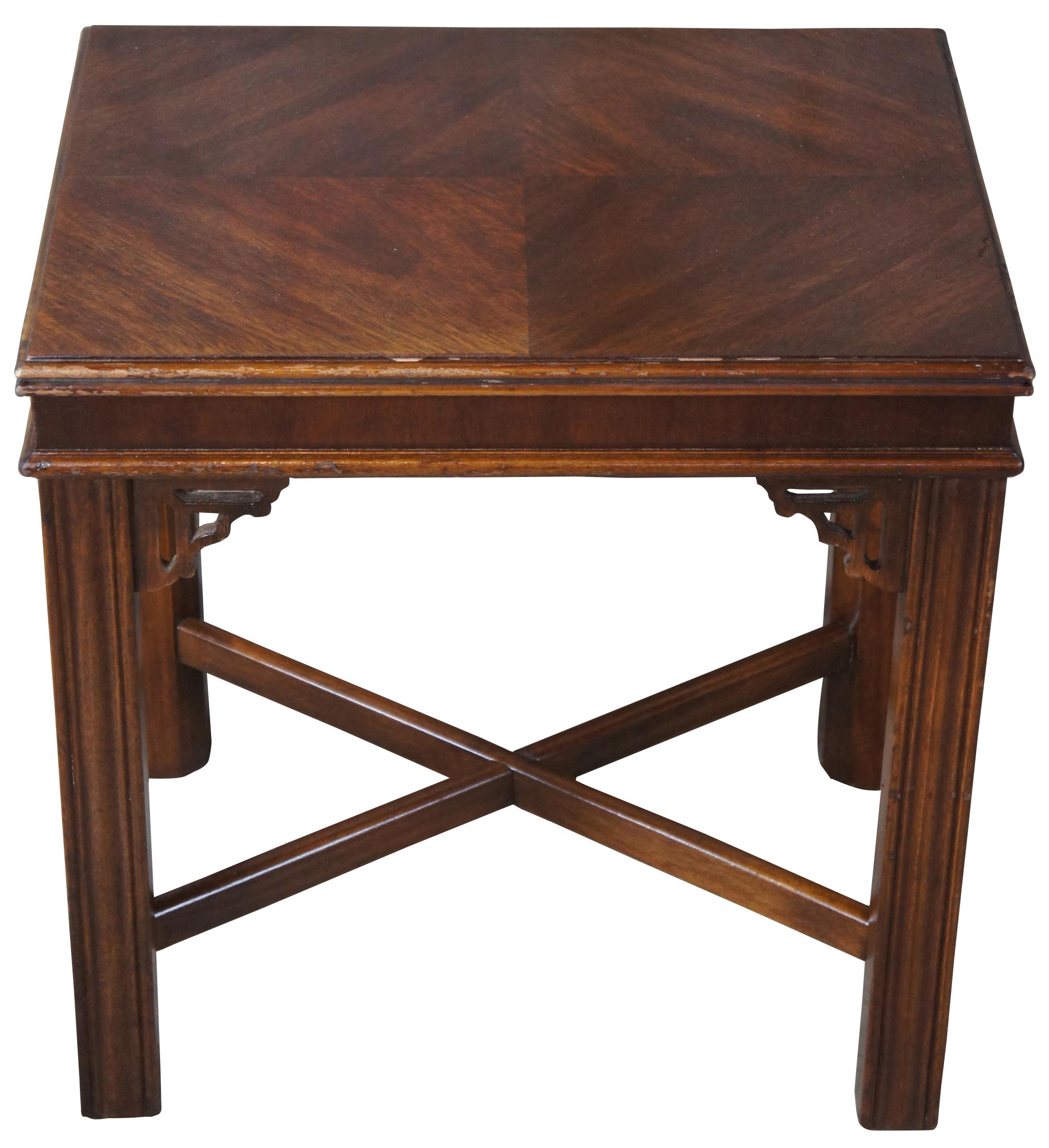 Chinese Chippendale side table by Lane Furniture, circa 1980, Altavista Virginia. Made from walnut with a bookmatched veneered top over fluted legs connected by X-stretcher.