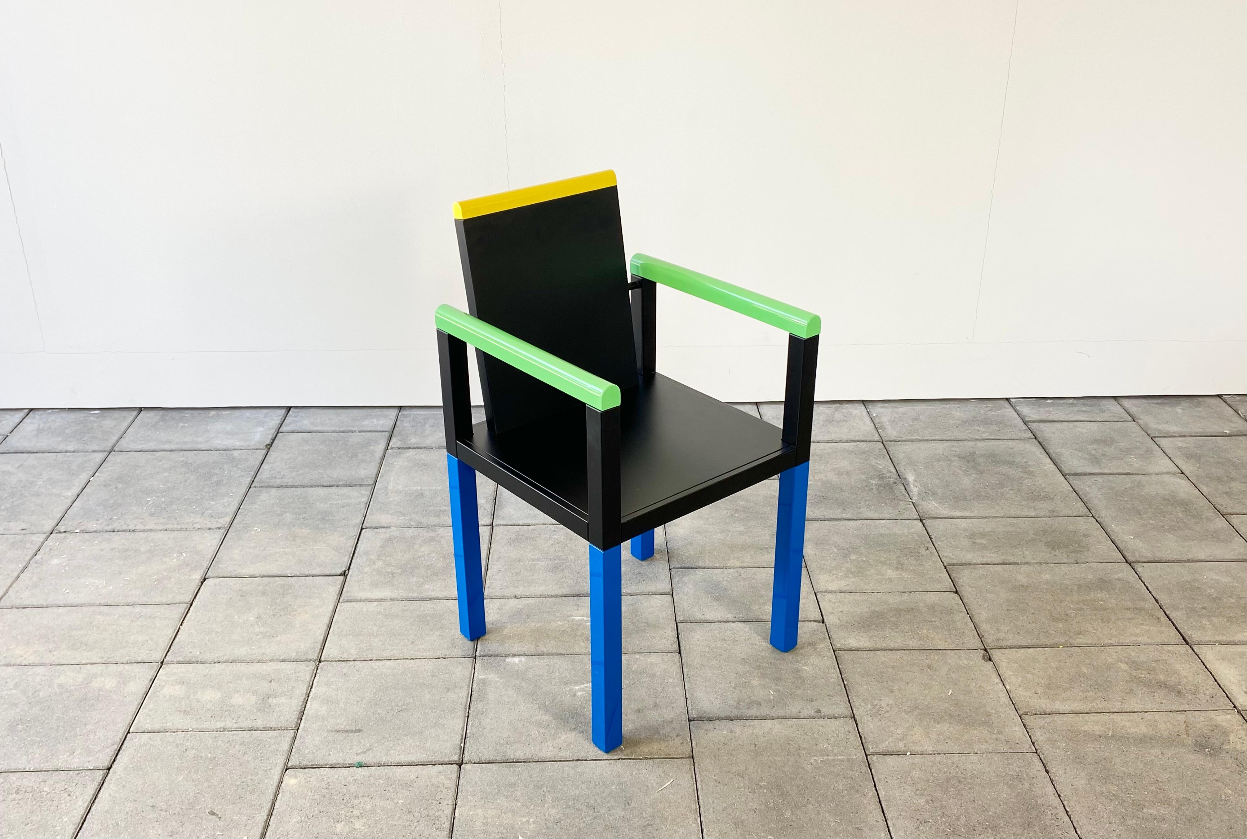1980ies Memphis Milano Palace chair in colored lacquered wood designed by George Sowden, 1983.

George Sowden studied architecture at Gloucestershire College of Art in the 1960ies and moved to Milano in 1970. He worked with Ettore Sottsass and