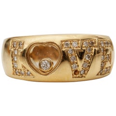 Retro 1980s 0.20 Carat Total LOVE Diamond 18 Karat Gold Ring