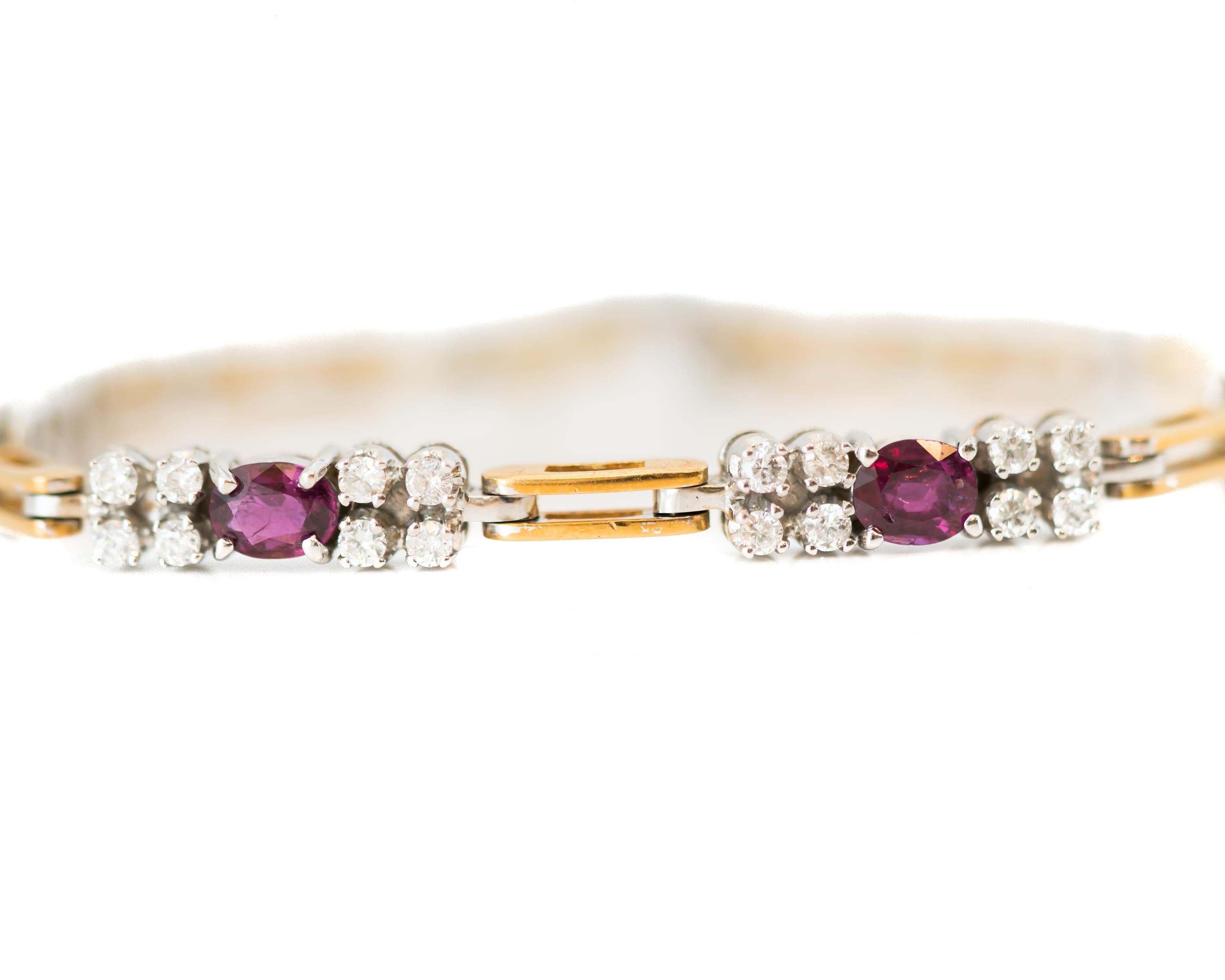 1980s Diamond and Ruby, 18 Karat White and Yellow Gold Two Tone Link Bracelet

Features 32 Round Brilliant Diamonds and 4 Oval Red Rubies. These gorgeous gemstones are set in White Gold and alternate with Yellow Gold links. Each of the 18 Karat