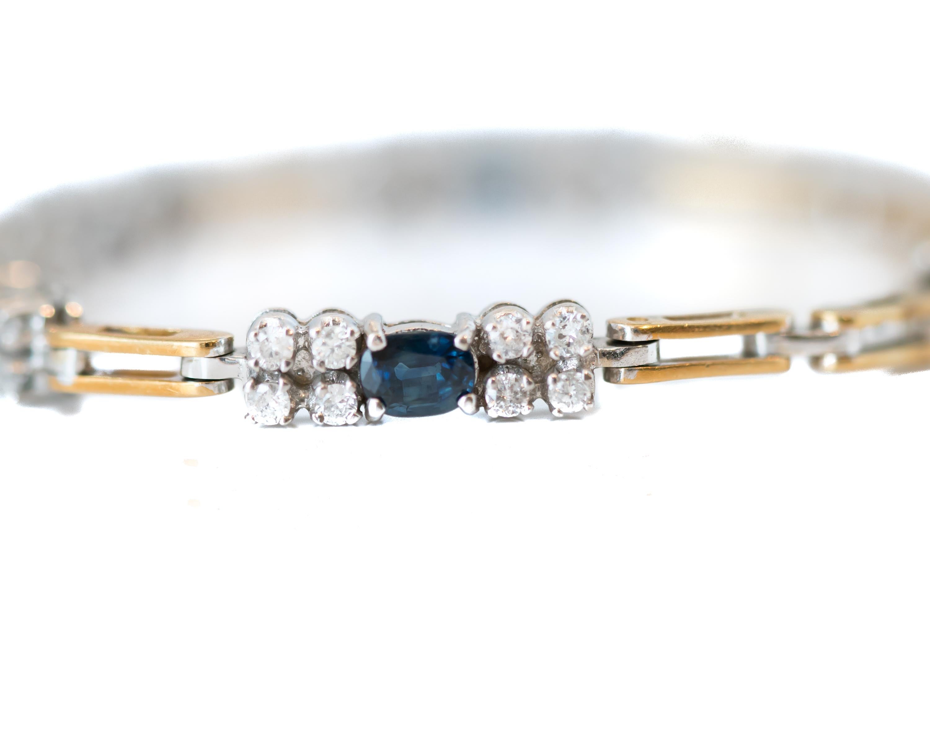 1980s Diamond and Sapphire, 18 Karat White and Yellow Gold Two Tone Link Bracelet

Features 32 Round Brilliant Diamonds and 4 Oval Sapphires. These gorgeous gemstones are set in White Gold and alternate with Yellow Gold links. Each of the 18 Karat