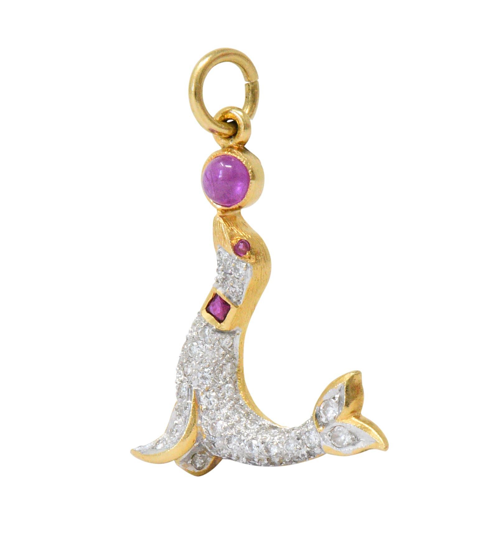 Charm is designed as a circus seal balancing a red ruby cabochon ball on its nose; translucent and a slightly purplish-red color

Pavè set throughout by round brilliant cut diamonds weighing approximately 0.80 carat total; eye-clean and