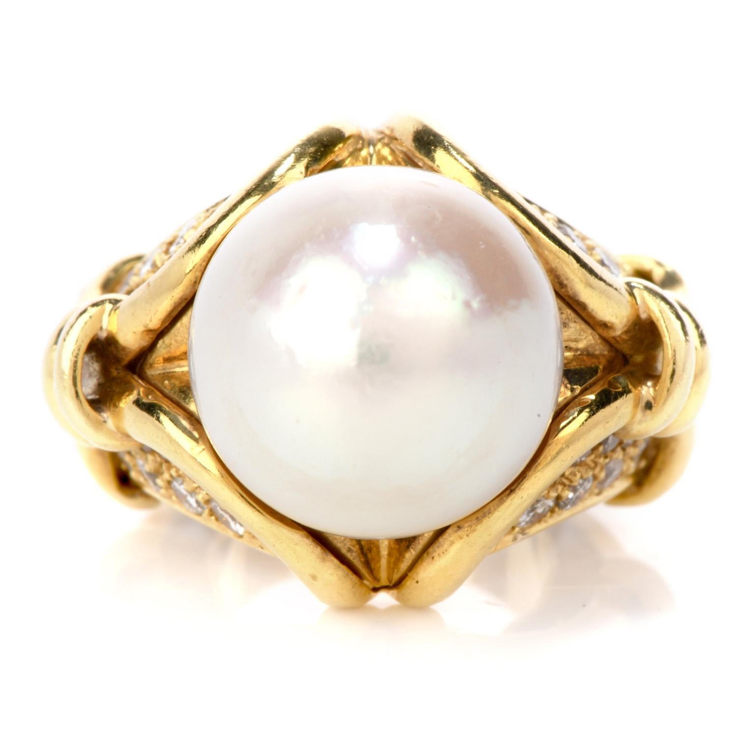 This enchanting cocktail ring is crafted in solid 18K Yellow gold and is centered by a beautiful genuine Pearl of approximately 13mm wide

It is furthermore embellished with 40 genuine round cut Diamonds weighing  approximately: 1.05 carats, H-I