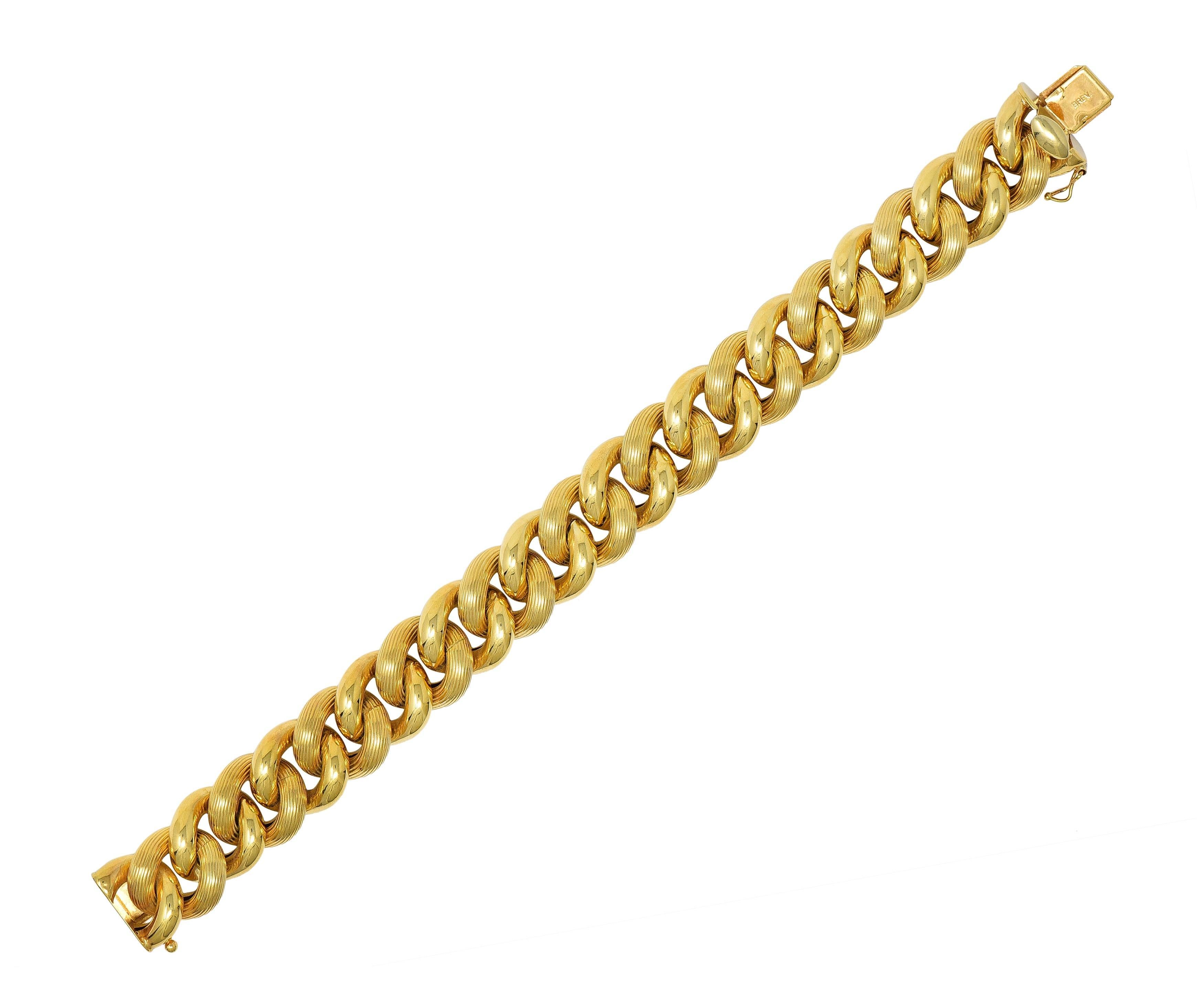 Designed as a puffed fancy curb link chain 
Alternating with smooth and fluted textured links 
Completed by a concealed clasp closure 
With hinged figure eight safety 
Stamped for 14 karat gold 
With maker's mark, signed for Italy
Circa: 1980s
Width