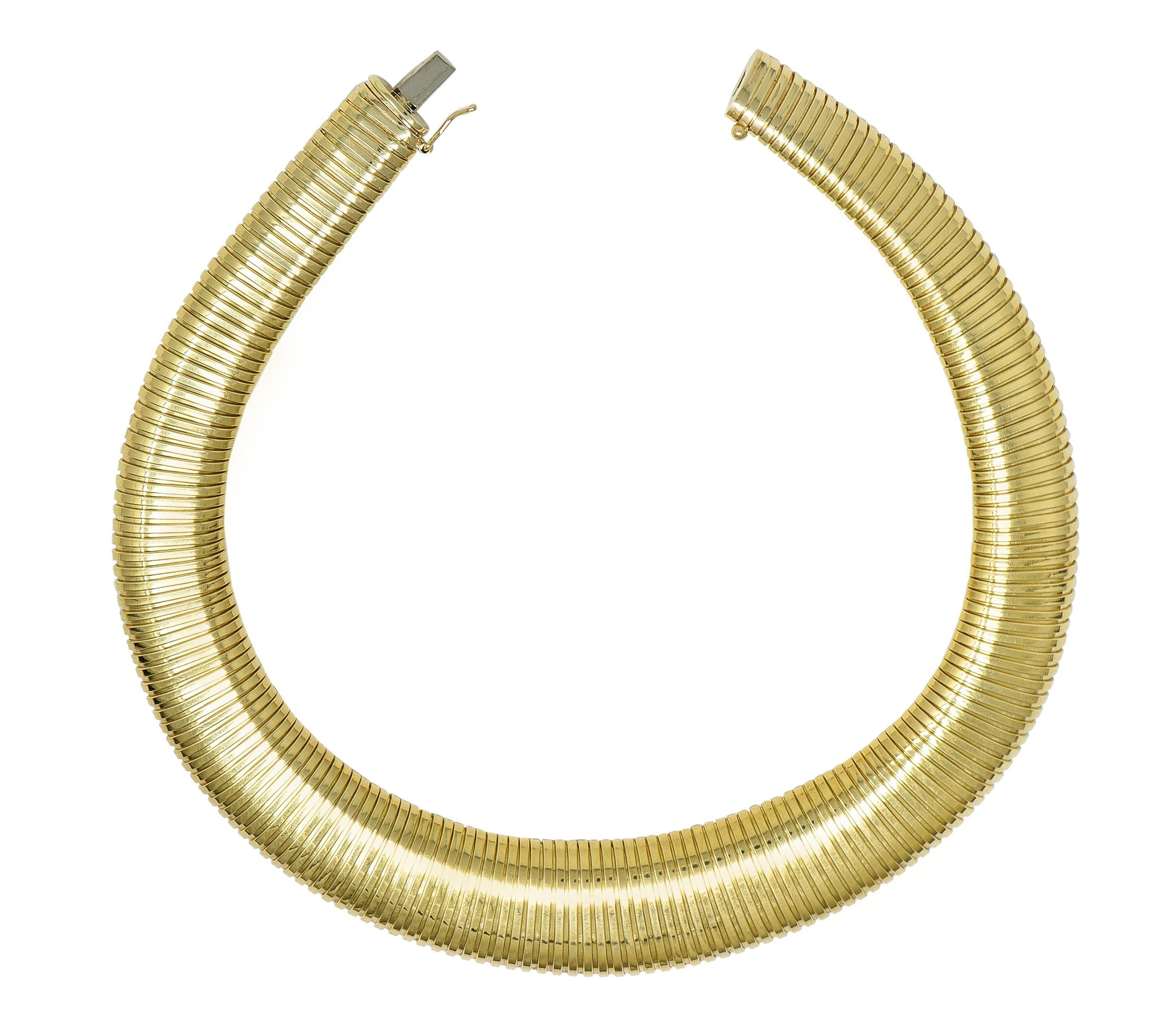 Designed as a graduated tubogas style necklace
Comprised of flexible segments
With high polish finish
Completed by concealed clasp closure
Stamped for 14 karat gold 
Stamped for Italy
Circa: 1980s
Width at widest: 13/16 inch 
Length: 16 inches
Total
