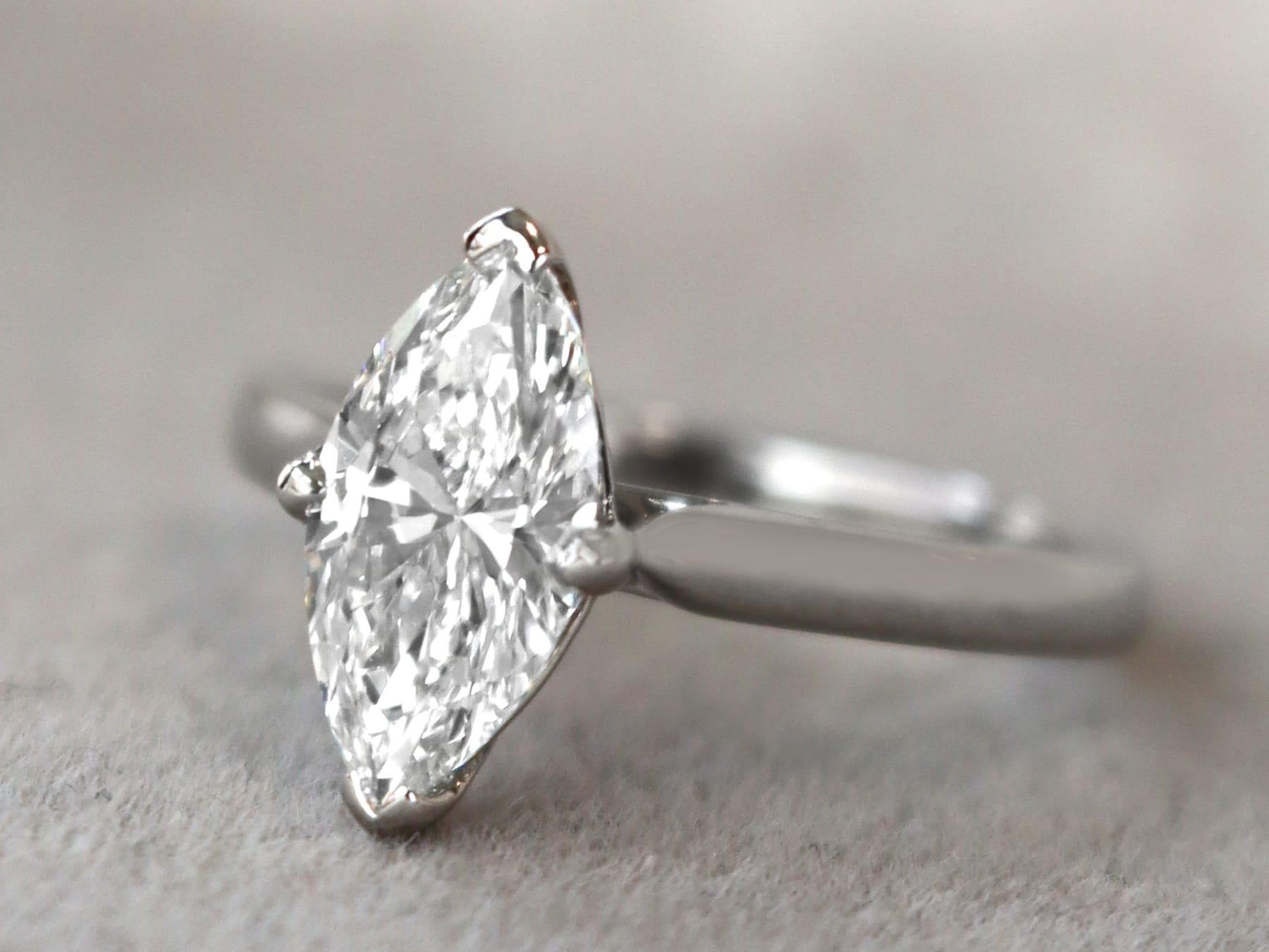 A stunning vintage 1.41 carat diamond and 18 karat white gold solitaire style engagement ring; part of our diverse diamond jewelry and estate jewelry collections.

This stunning, fine and impressive marquise cut diamond solitaire engagement ring has