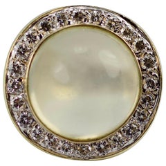 1980s 14 Karat Gold Moonstone with a Halo of Round Diamonds Euro Shank Ring