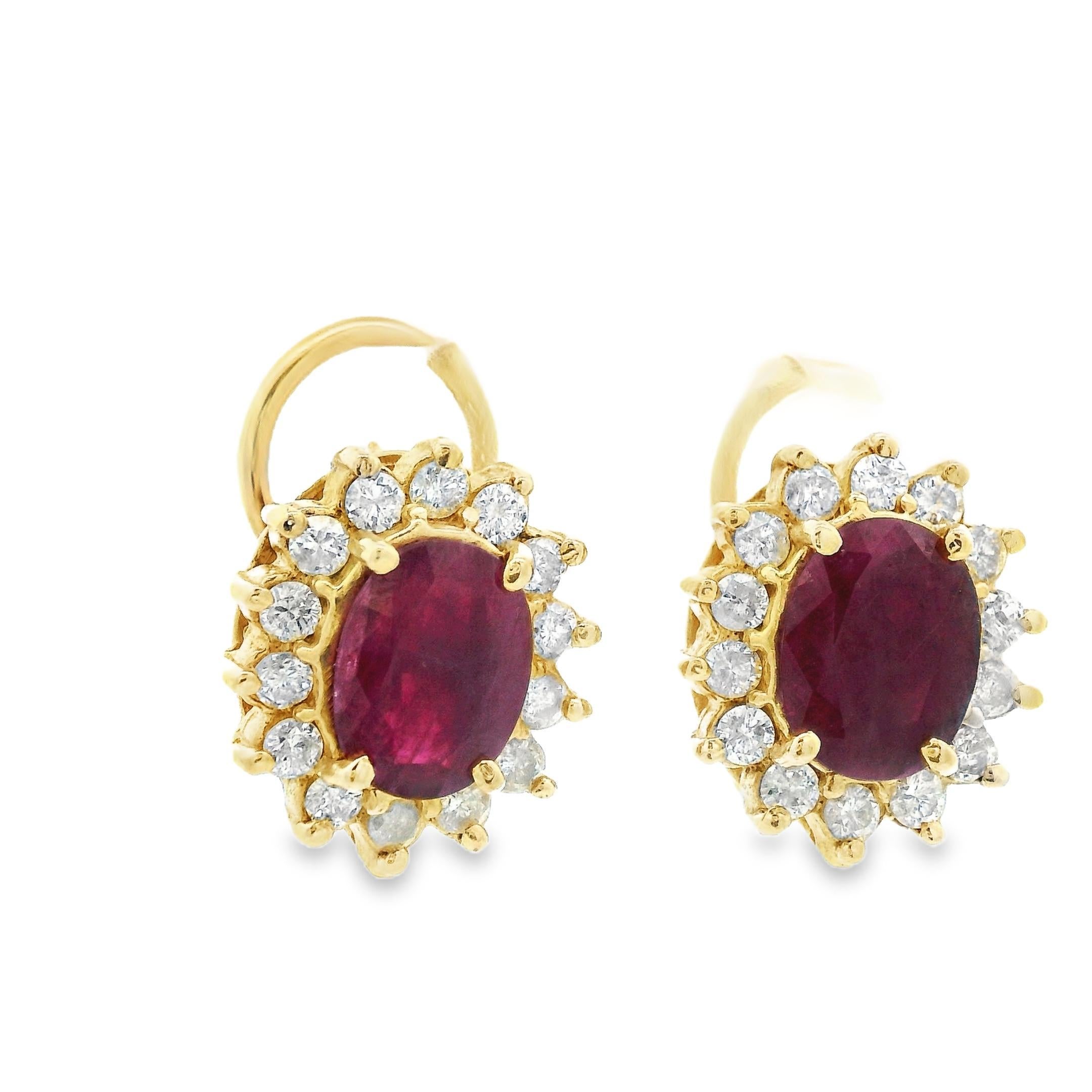 This is a beautiful pair of ruby and diamond earrings made in 14k yellow gold, from the 1980s. These earrings feature 4 carats total weight in oval cut natural ruby. Surrounding the ruby is a layer of round cut diamonds. These earrings are done in a