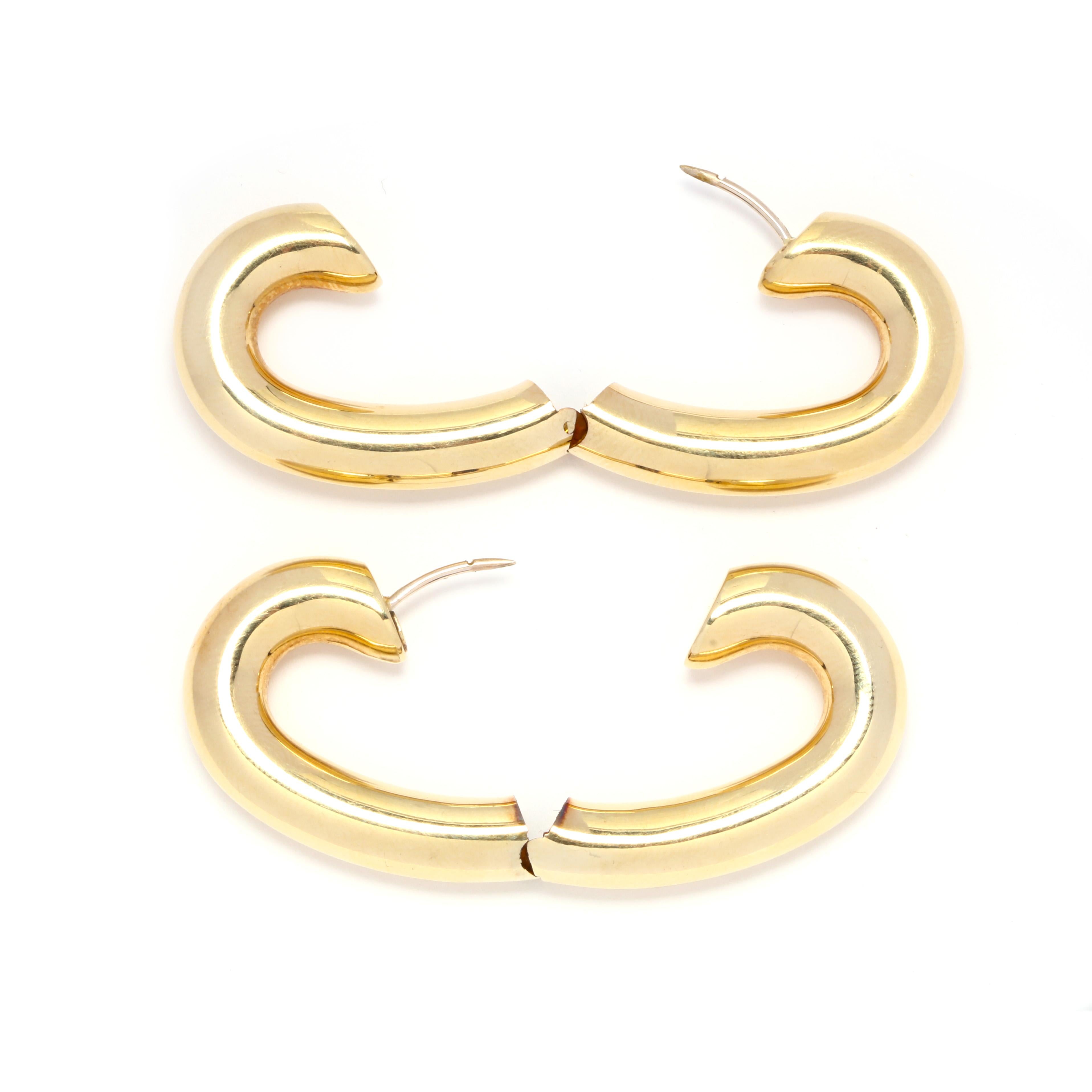 Circa 1980's, a pair of 14 karat gold large heart hoop earrings. A puffed, tube design with a hinge at the bottom.

Length 1.75 in.

Height 1.25 in.

Width 6.3 mm

9.96 dwts.

* Please note that this is a vintage item and may show signs of wear. It