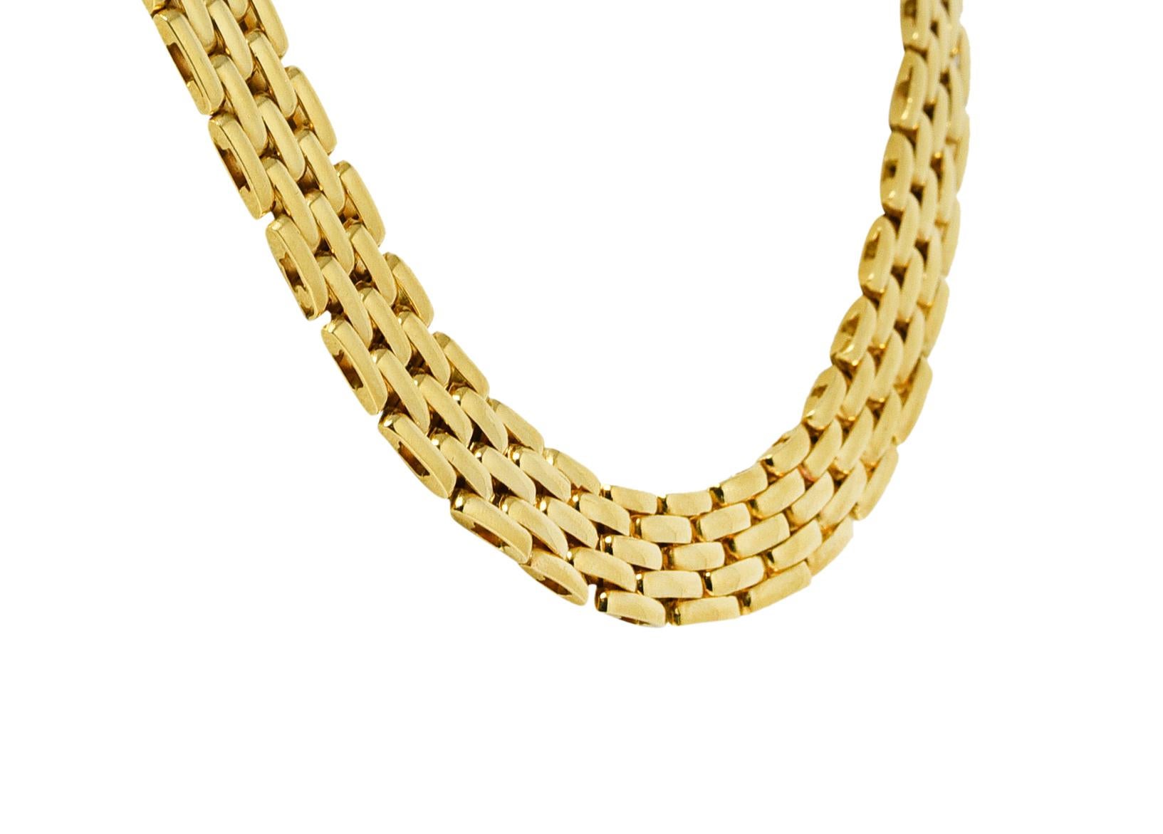 Comprised of hinged mesh-like panther style links. With high polished gold finish. Completed by hidden clasp closure with figure eight safety. Stamped 18K with Italian assay marks for 18 karat gold. Circa: Late 20th Century. Width: 7/16 inch.