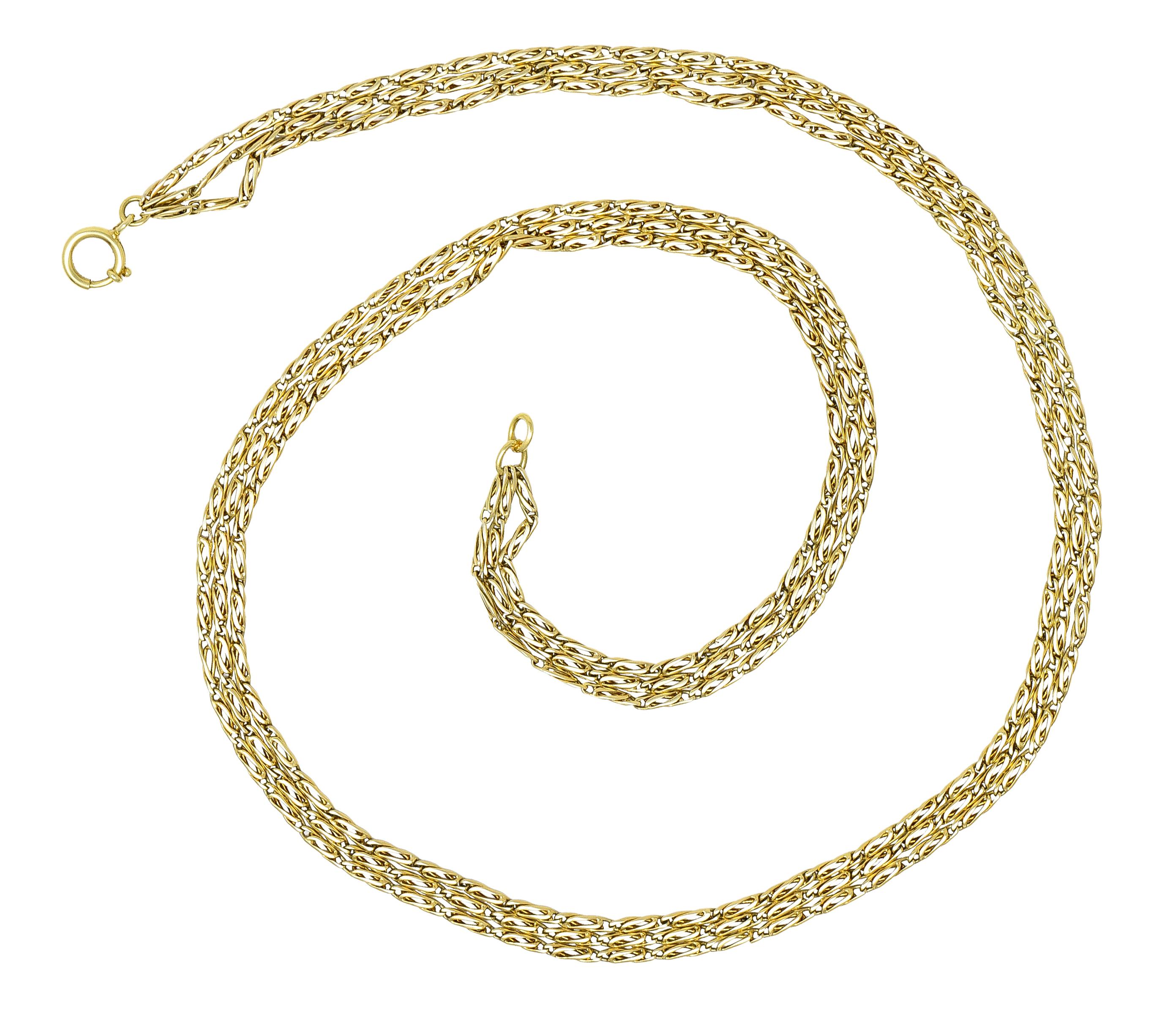 Designed as three strands of scroll link chain. Featuring a high polish finish. Completed by large spring clasp closure. Stamped 750 for 18 karat gold. With maker's mark. Circa: 1980's. Width at widest: 1/4 inch. Total length: 24 inches. Total