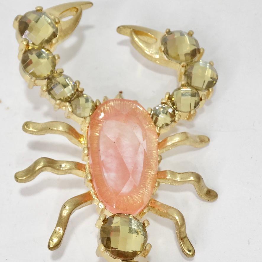 Beautiful 18K gold plated scorpion brooch circa 1980s featuring a gorgeous pink rhinestone at the center! This is such a fun way to add a pop of bling to your look. Pin this to a Chanel denim jacket to add a glamorous flare to an every day look or
