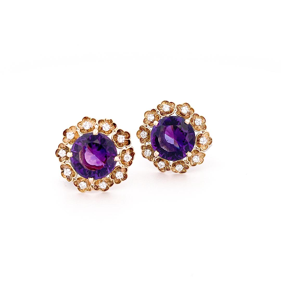 From the Eiseman Estate collection, circa 1980’s, 18 karat yellow gold amethyst flower earrings. These earrings are crafted with 2 round purple amethysts with a combined approximate weight of 15.24 carats. Additionally, surrounding the amethysts, 20