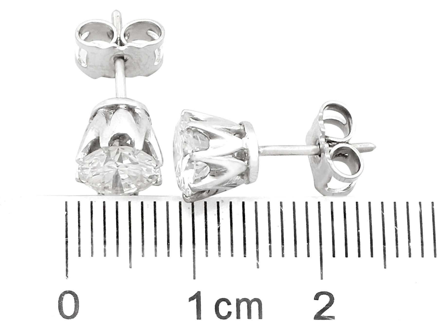 Round Cut 1980s 1.90 Carat Diamond and Platinum Stud Earrings For Sale