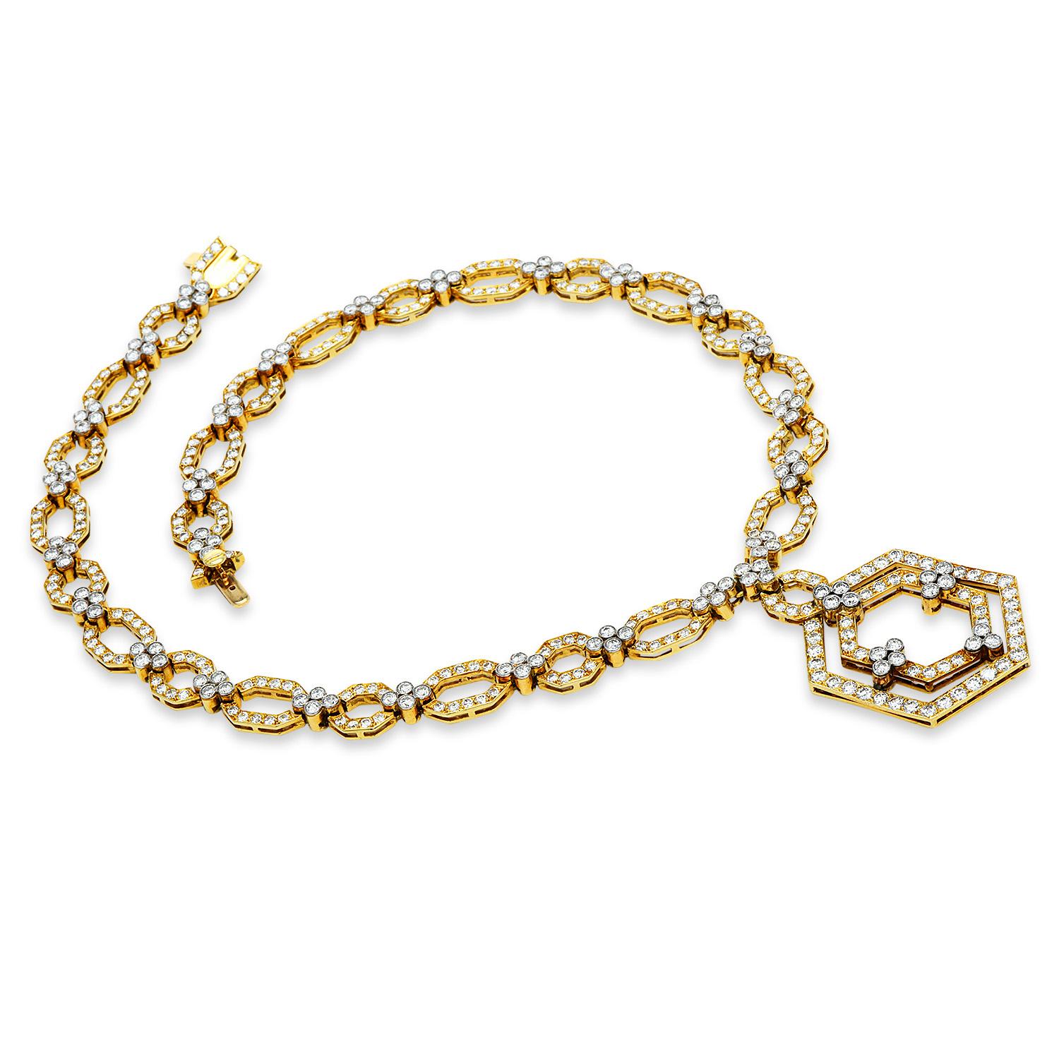 Geometrical 1980's vintage beauty! This statement piece is crafted in solid 18K Yellow gold with white gold accents. The Hexagon shape has been uplifted to another level with this exquisite piece. 
cluster diamonds accented links, unite the multiple