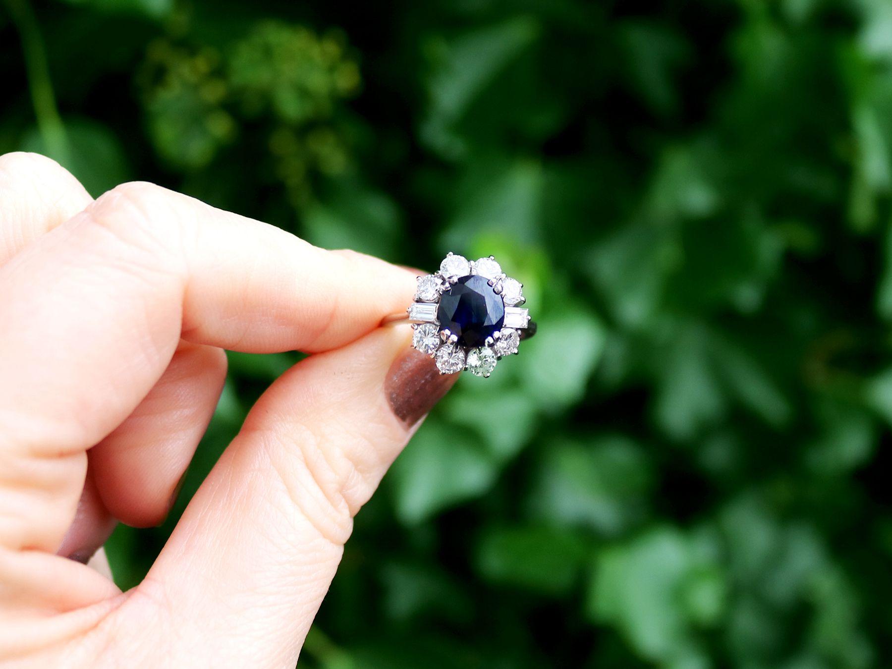 A stunning vintage 2.46 carat natural blue sapphire and 1.50 carat diamond, 18 karat white gold cluster ring; part of our diverse vintage jewelry and estate jewelry collections.

This stunning, fine and impressive vintage sapphire diamond cluster