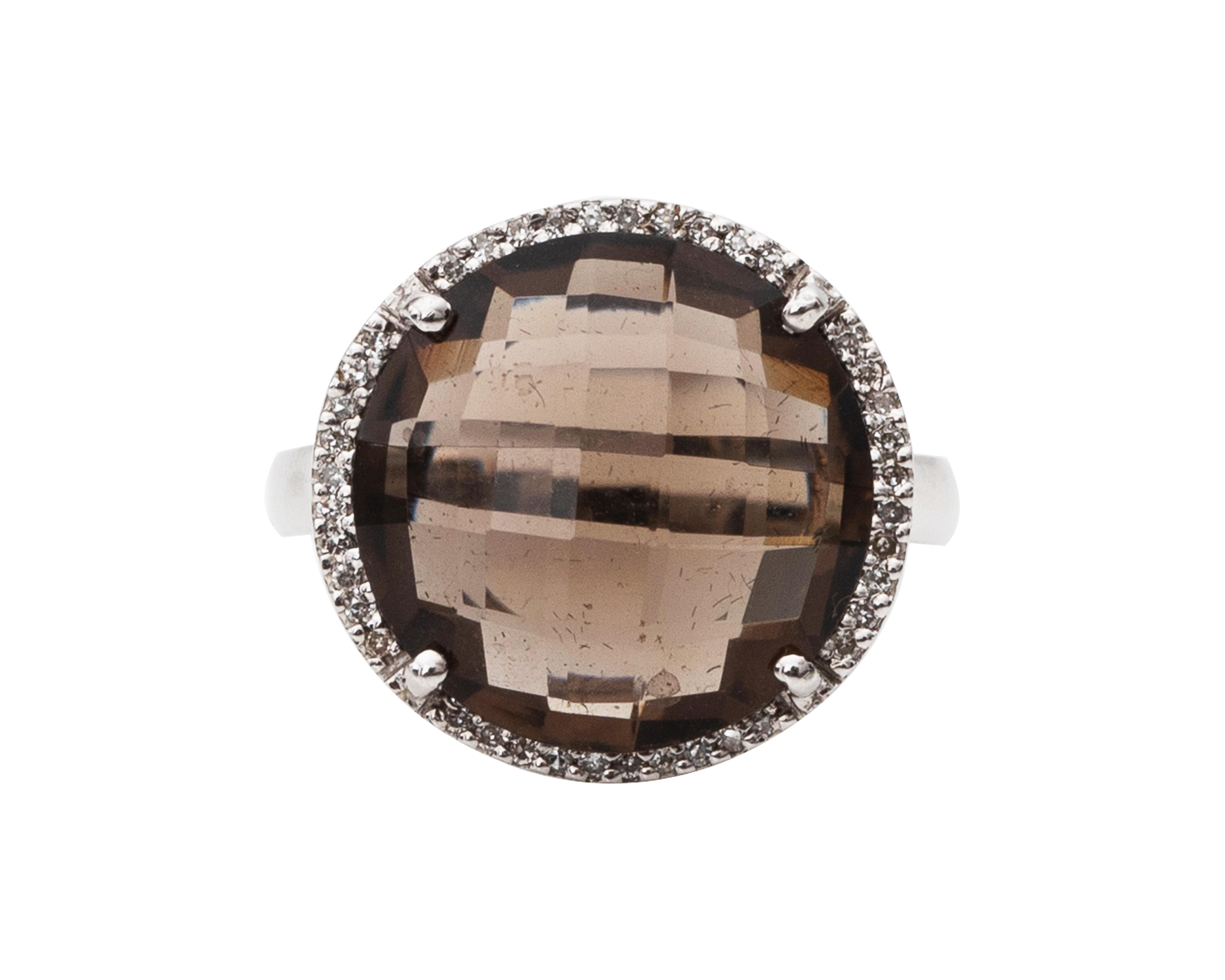 Item Details:
Metal type: 14 Karat White Gold
Weight: 5.8 grams
Size: 6 (resizable)

Smokey Quartz Details:
Cut: Fantasy Cut
Carat 4 Carats 

Gorgeous, yet simple ornate larger ring from the 1980s. It features a beautiful 4 Carat Smokey Quartz in